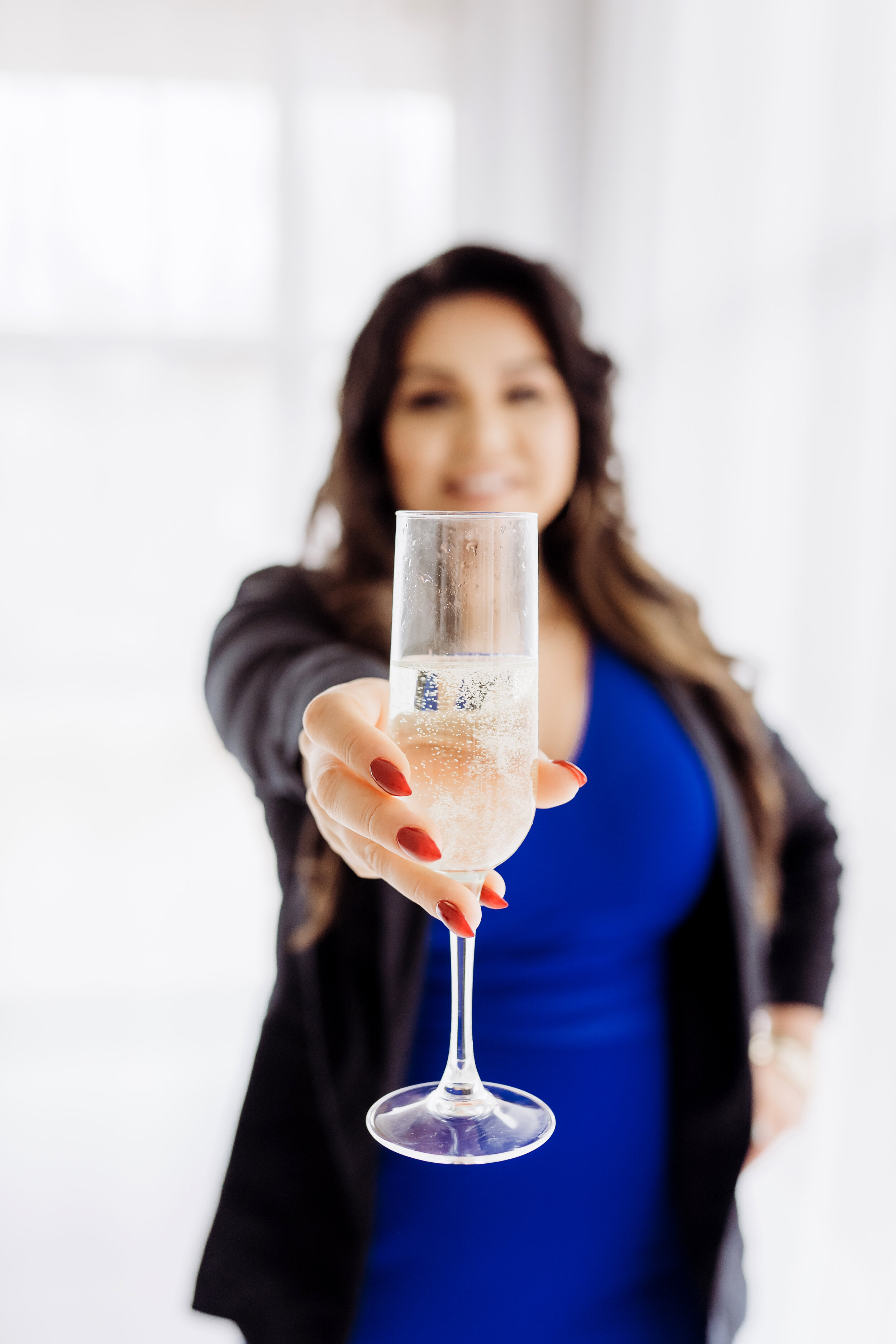 Realtor holding up champagne glass