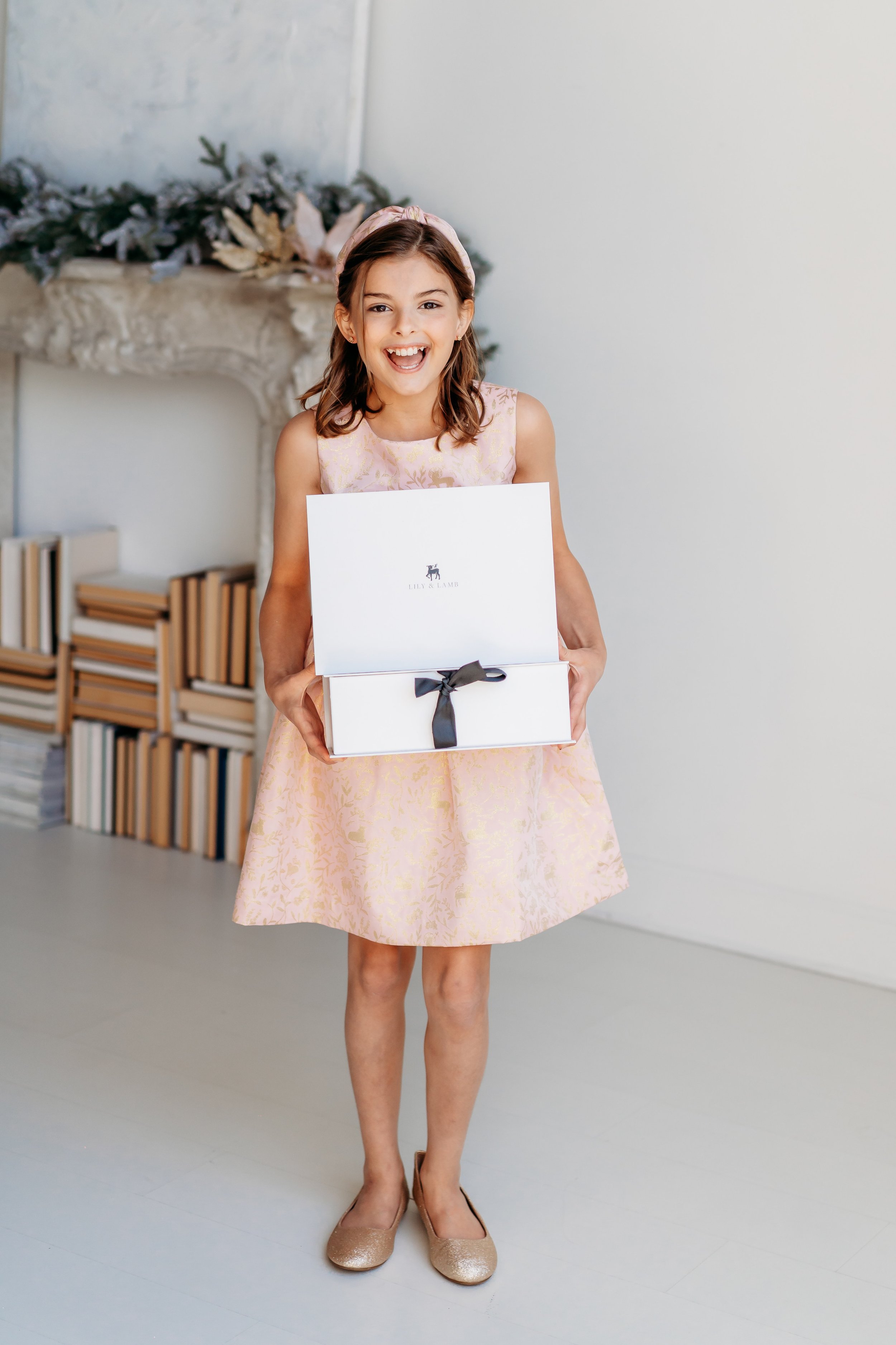 Girl holding gift boxes for e-commerce company photo