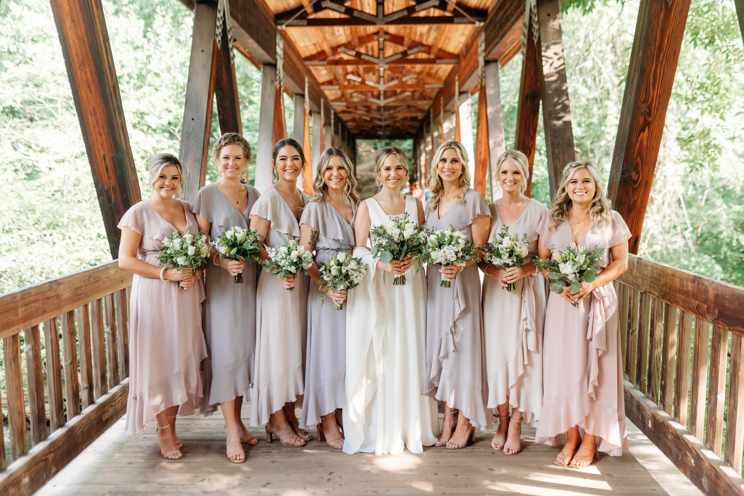 Bridesmaids on bridge for Roswell Mill Wedding
