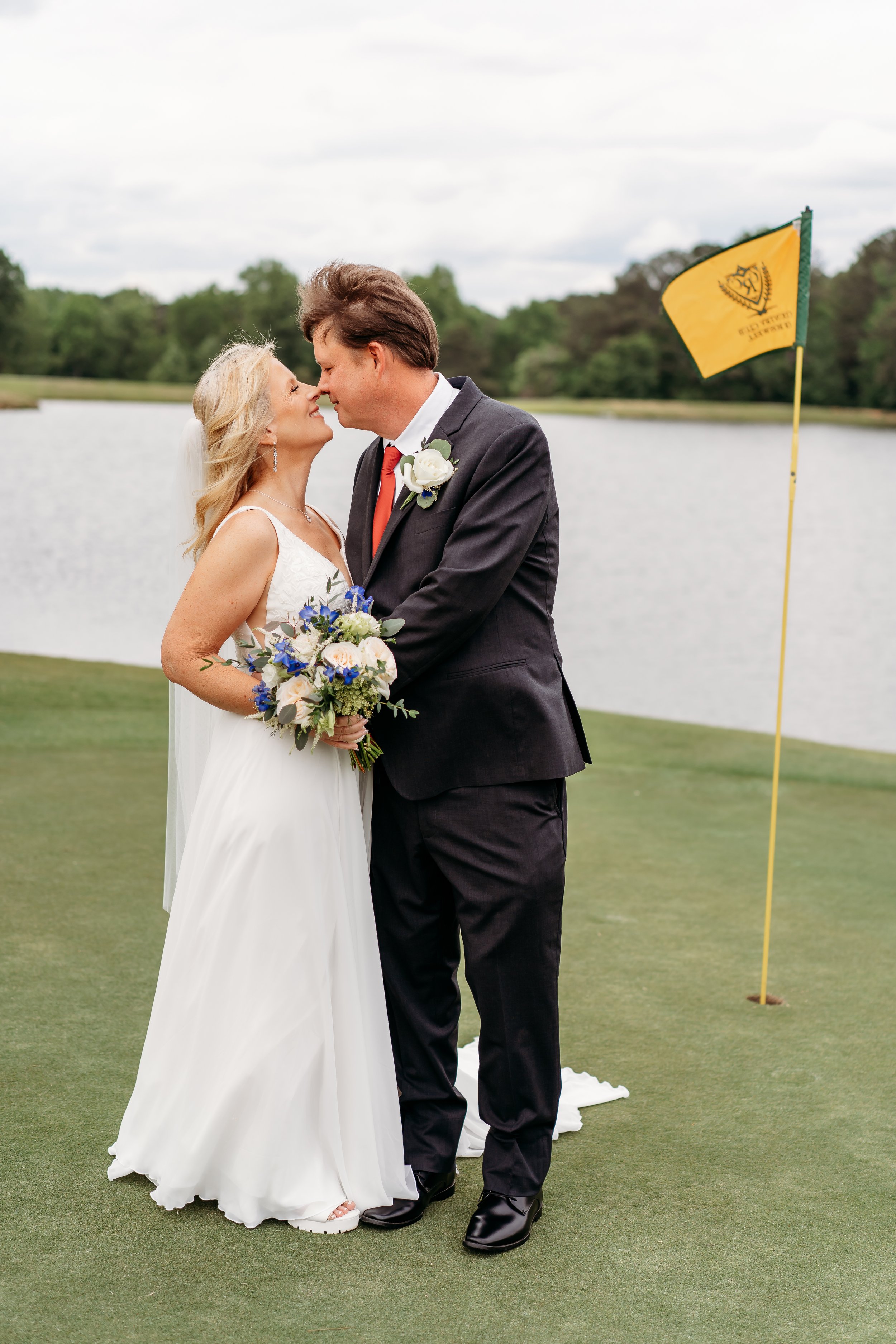 Wedding couple on green at Altanta Country club