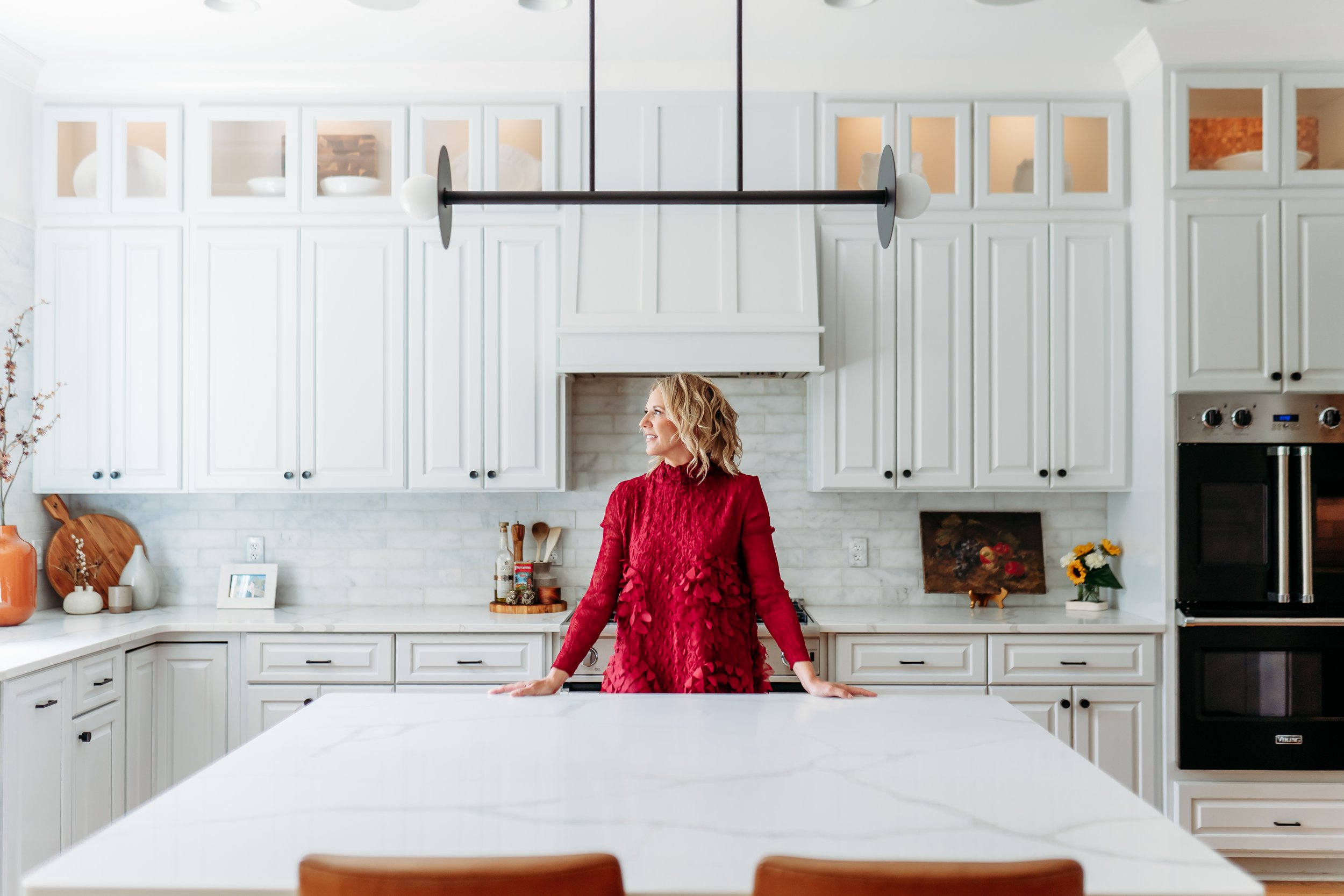 Lifestyle brand image of interior designer in kitchen of  Cumming, GA home 