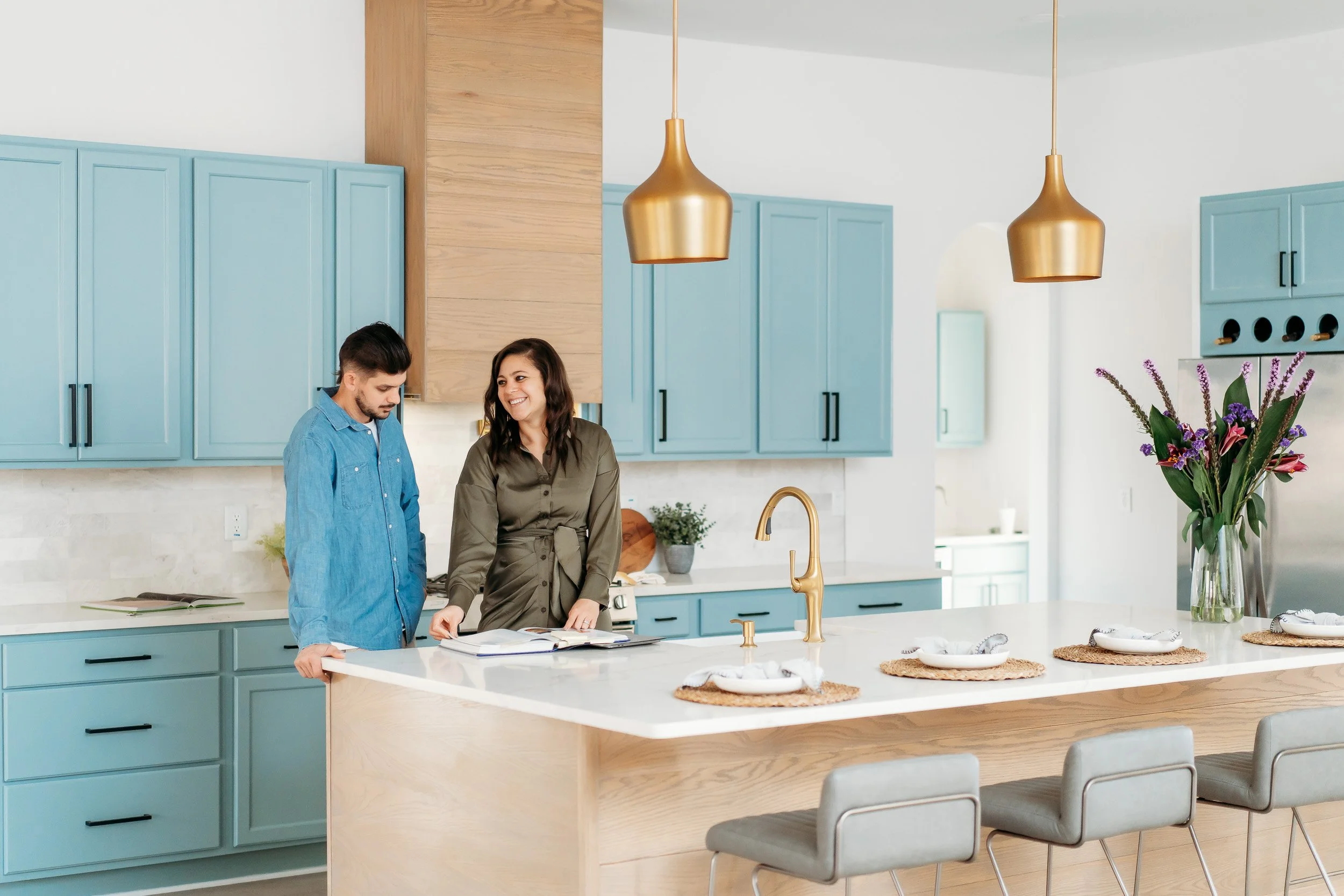 construction team in kitchen at island in newly constructed home for a personal branding photoshoot