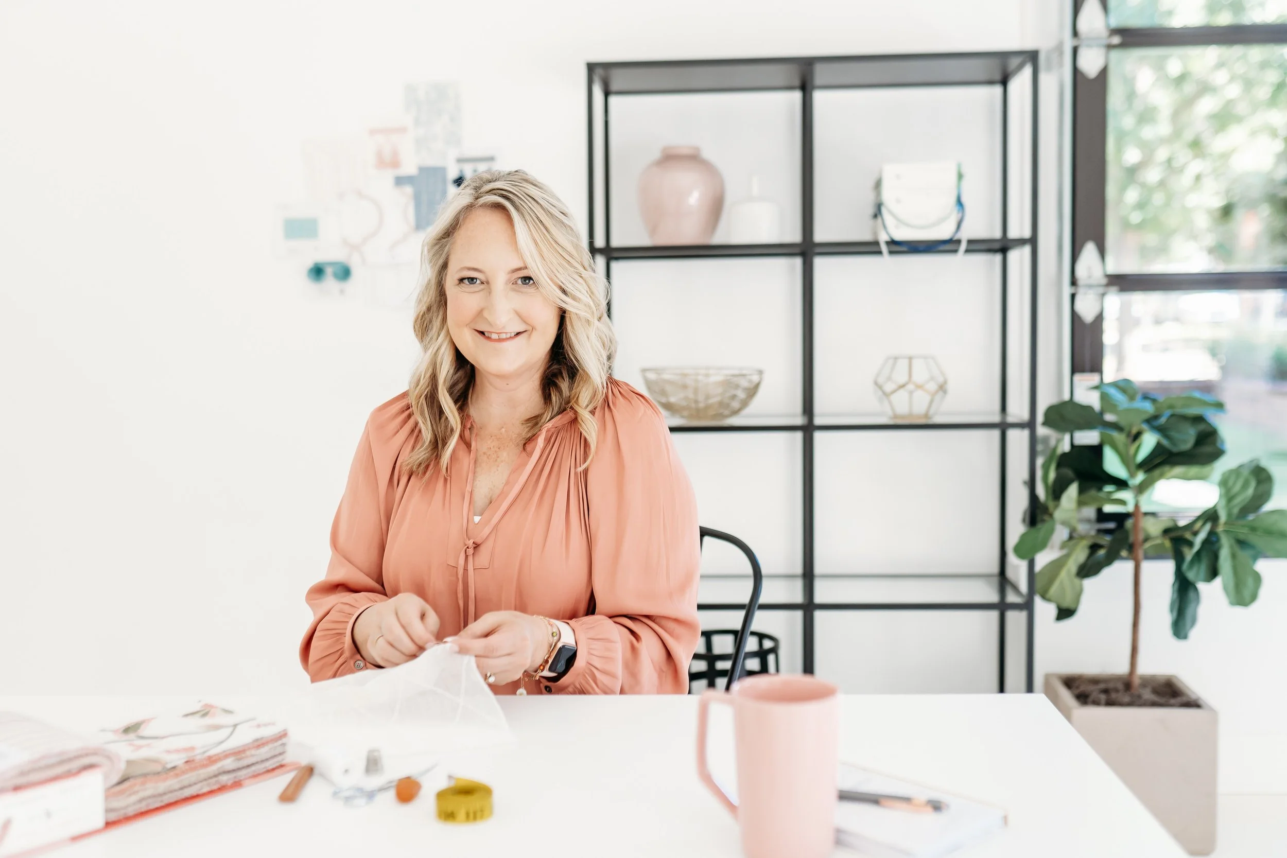 Interior designer sewing at Woodstock studio for Atlanta brand mini session