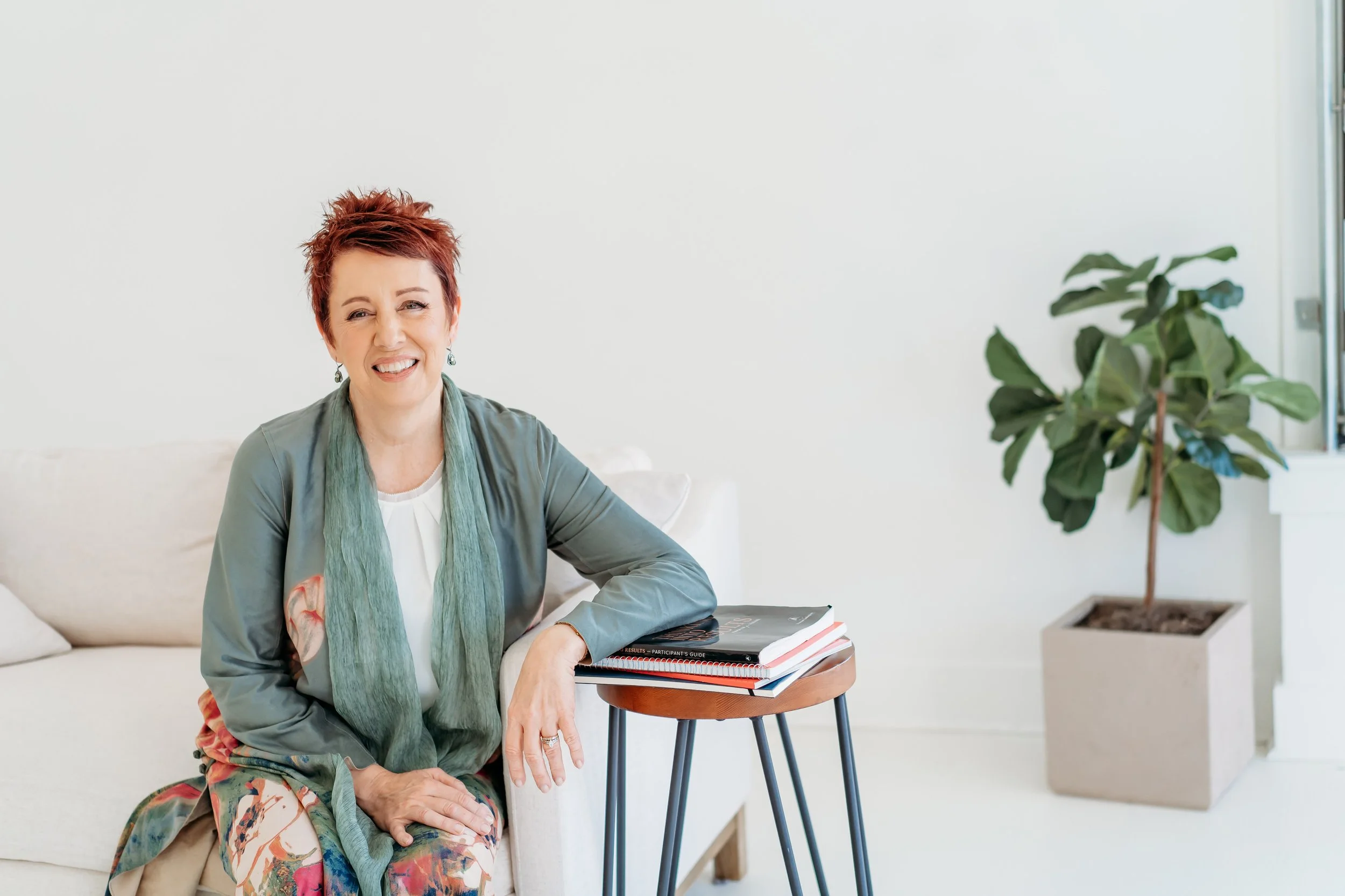 Coach sitting on couch at White Wall Studio Woodstock for brand mini session