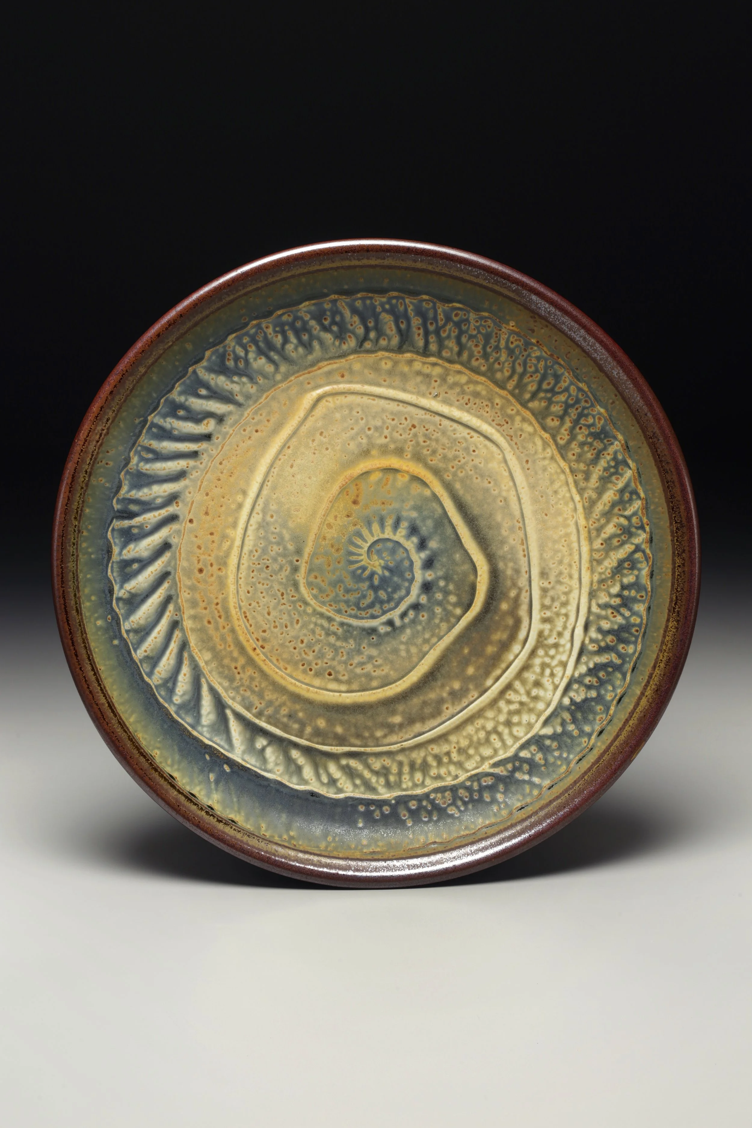 I make pots in a small studio on the French Broad River in Asheville. My pots speak to the historical nature of function and beauty found evident in many cultures. The forms I make are deeply influenced by tradition but with a contemporary twist on …