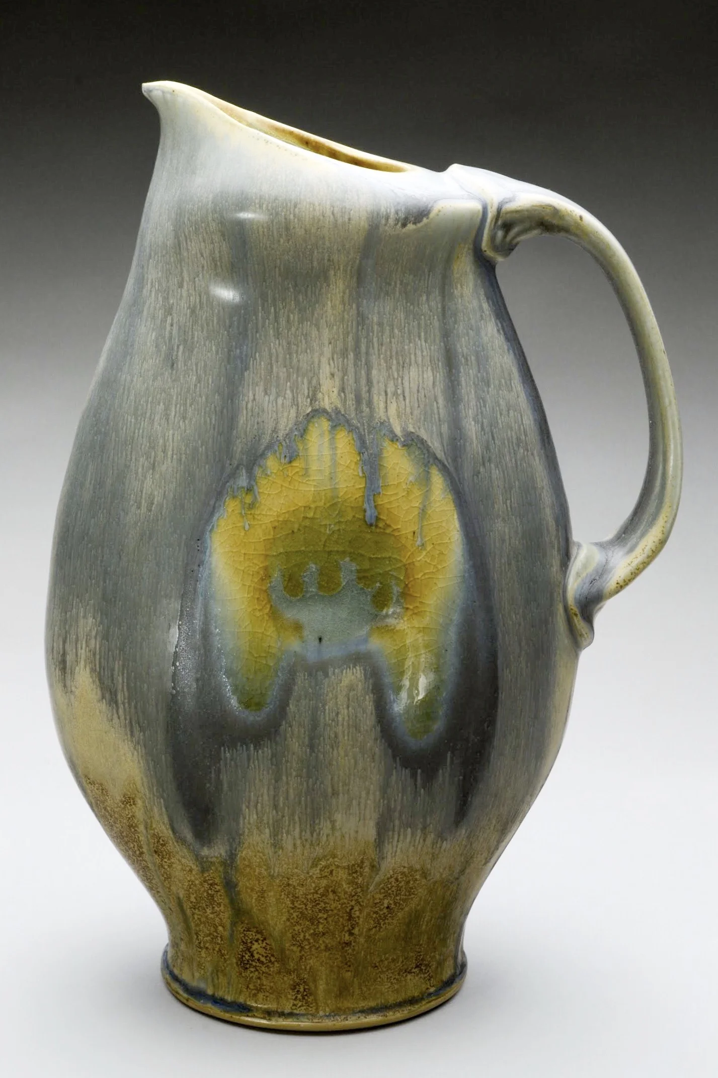 I make my pots out of a proto-porcelain that is mostly wheel thrown, sometimes cast, and fired in a gas reduction kiln. There are elements of hand-building, extruding, and mold forming incorporated throughout the body of the work. In general I am mo…