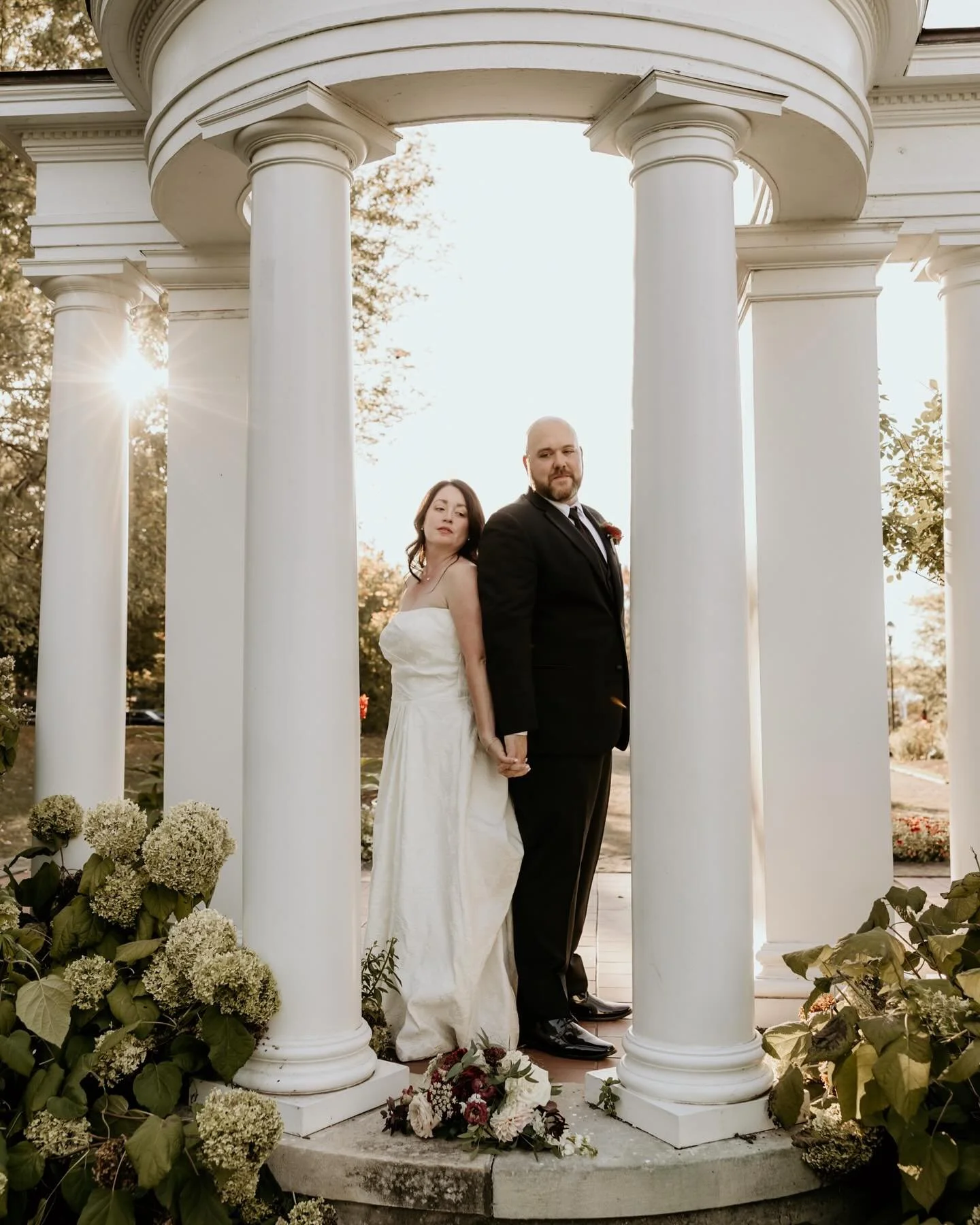 Two hearts, one promise 🤍✨ Capturing the quiet strength and beauty of love, framed by timeless architecture and golden light. 
&bull;
&bull;
#WNYWeddingPhotographer #WeddingInspiration #WeddingPhotography #BrideAndGroom #WeddingPortrait #WeddingDeta