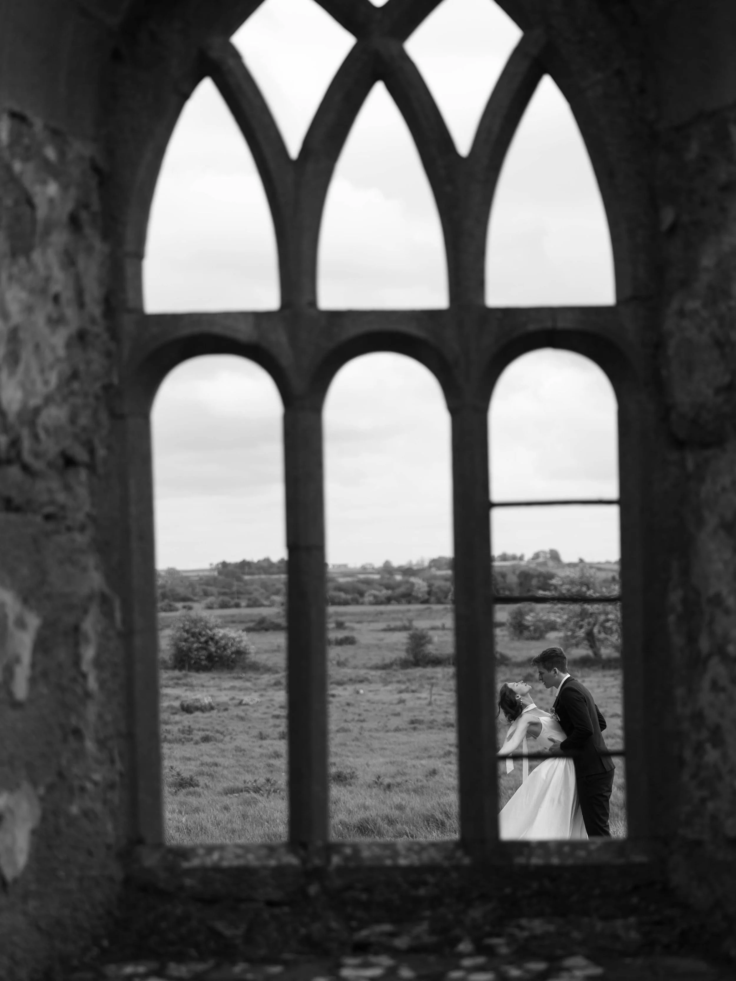Framed by ruins, held by forever.
&bull;
&bull;
Host: @vowandventure.co 
Model: @madisonandgabriel 
Dress: @rawgoldenrentals 
&bull;
&bull;
#ErrillyFriary #IrelandWeddingPhotographer #IrishWedding #DestinationWeddingPhotographer #MoodyWeddingPhotogra