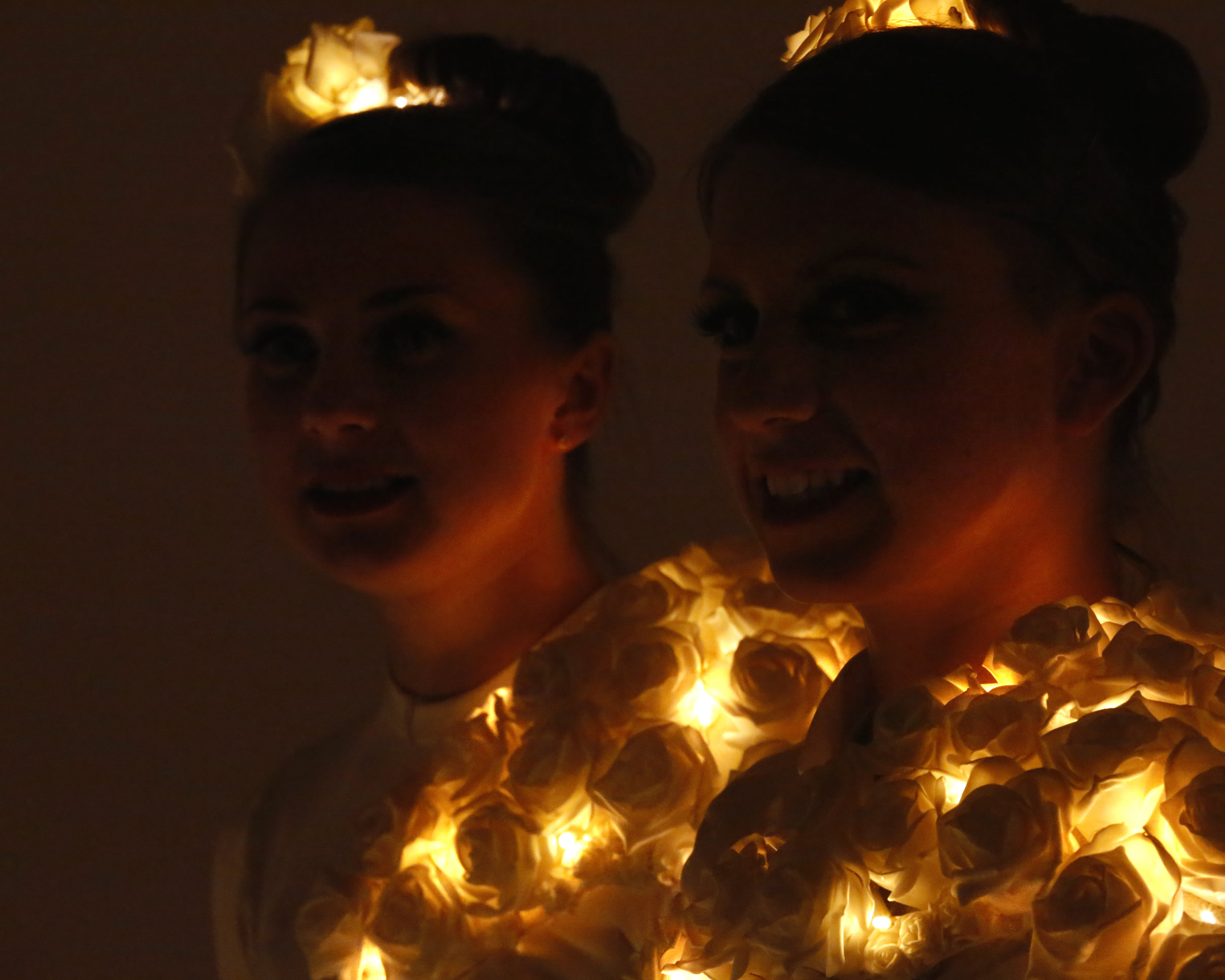 costume, white rose head dress and chest detail illuminated, Divine Company.jpg