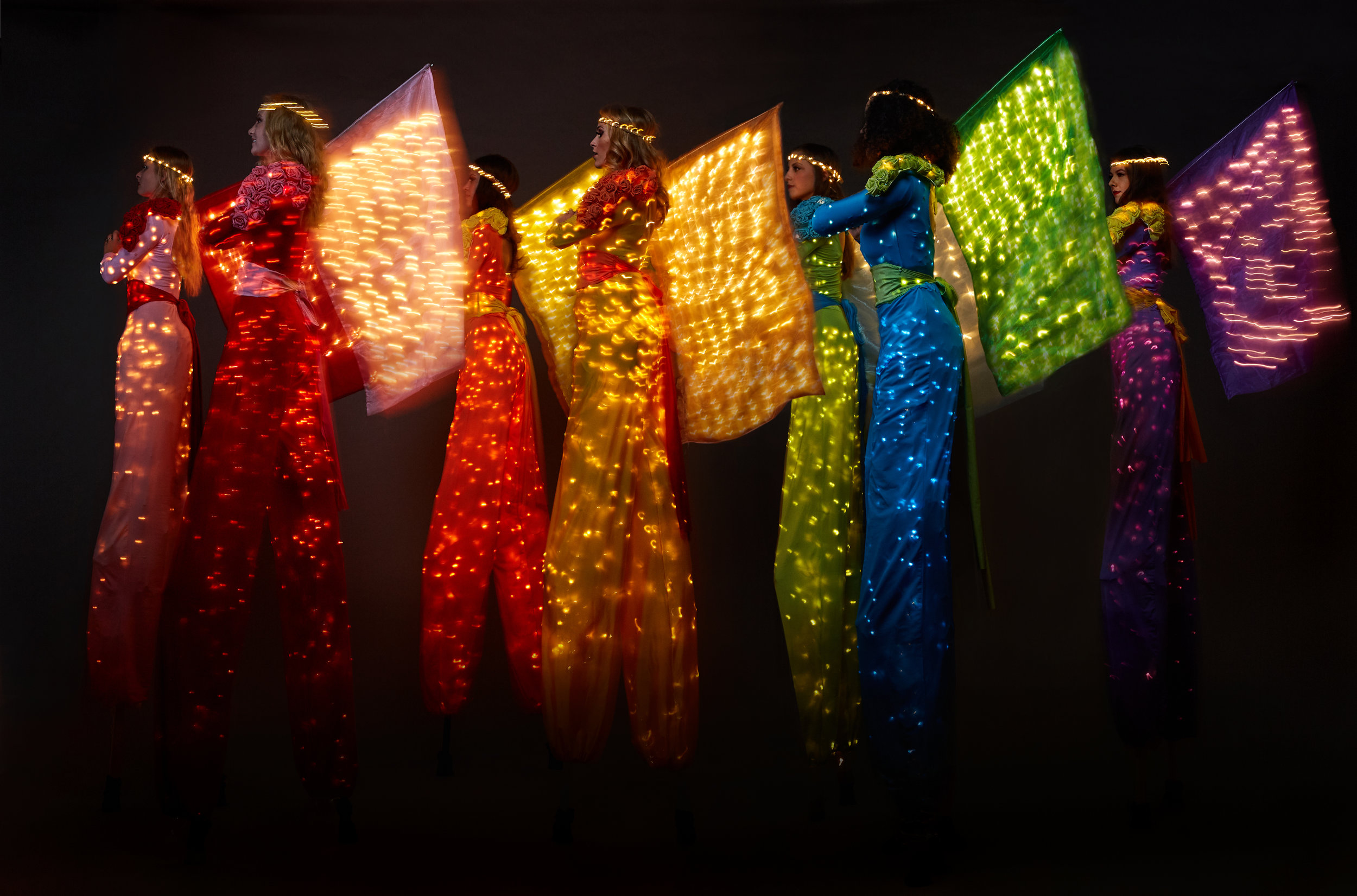 Colour Collection, illuminated stilt performance with flags, Divine Company.jpg
