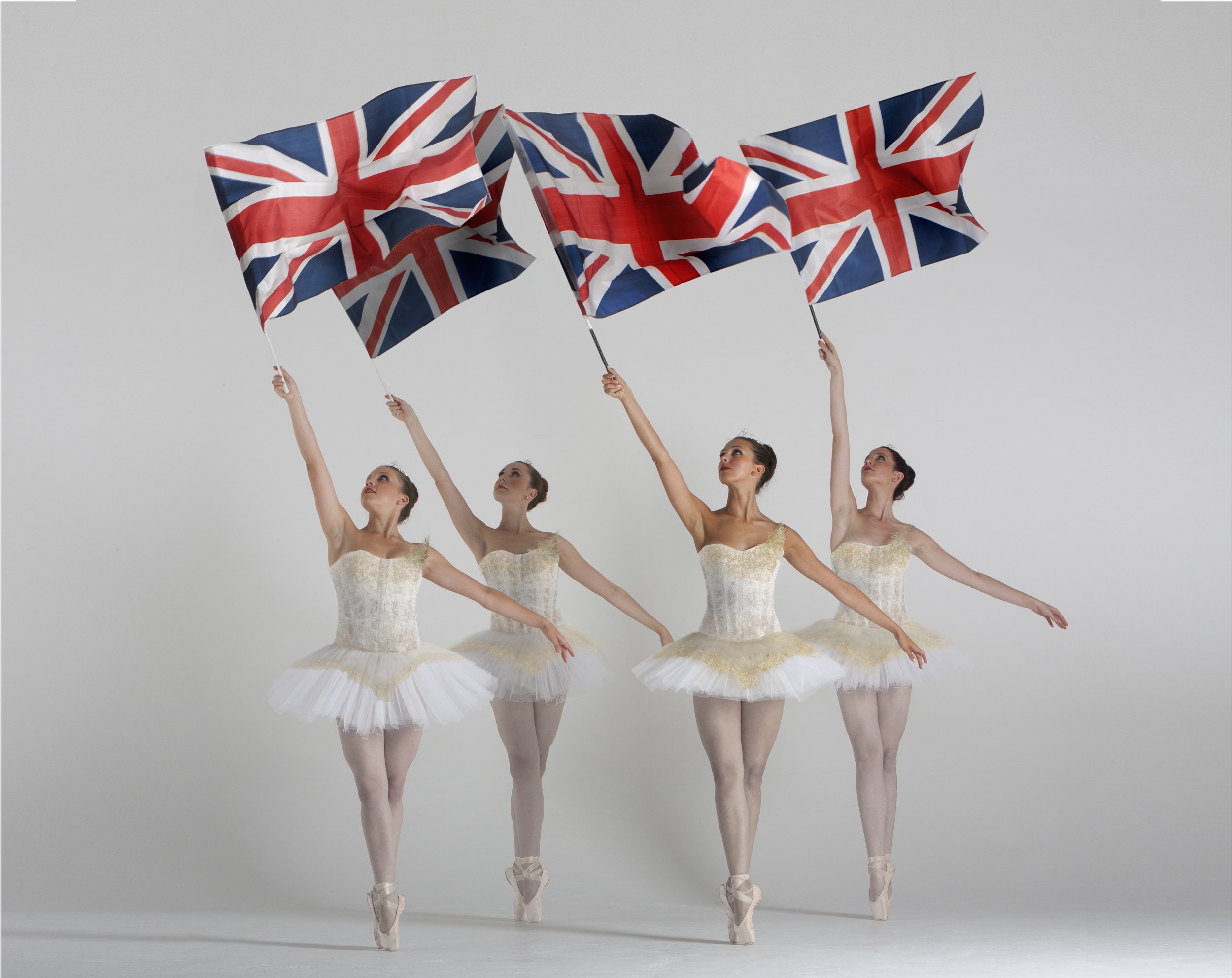 The London Cirque Ballet in white with Union Flags, Divine Company.jpg