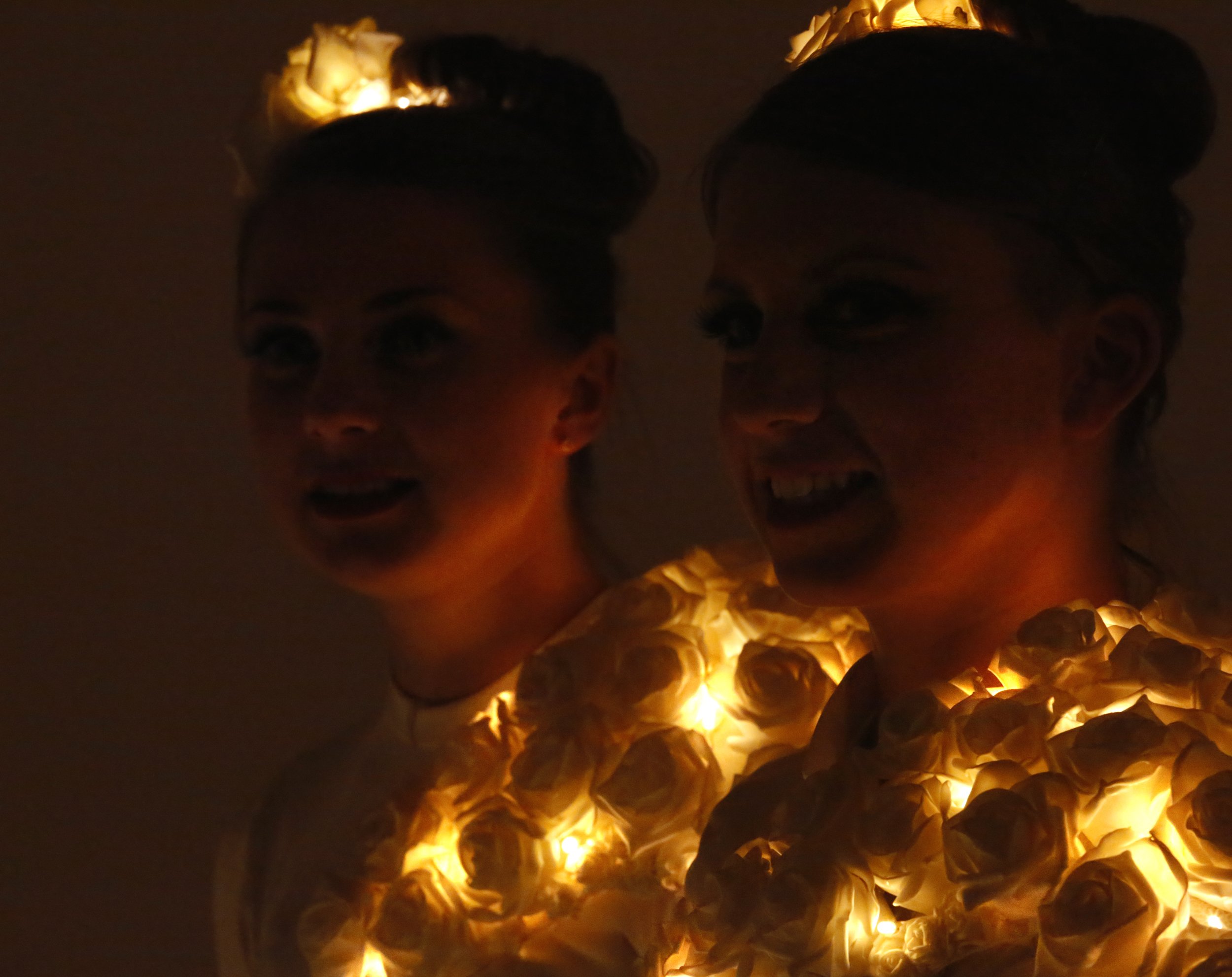 costume, white rose head dress and chest detail illuminated, Divine Company.jpg