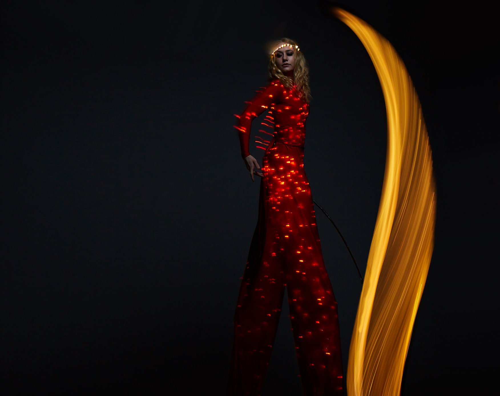 Colour Collection, illuminated stilt performance in red with ribbon, Divine Company.jpg