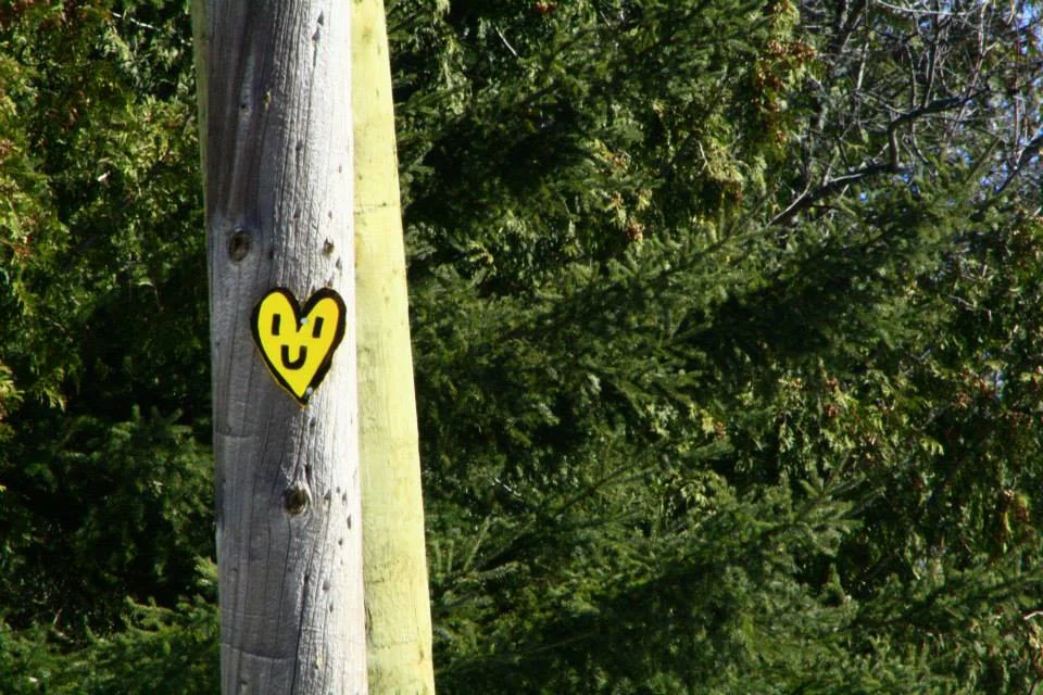 peter-yellow-heart-on-post-with-forest-background.jpg