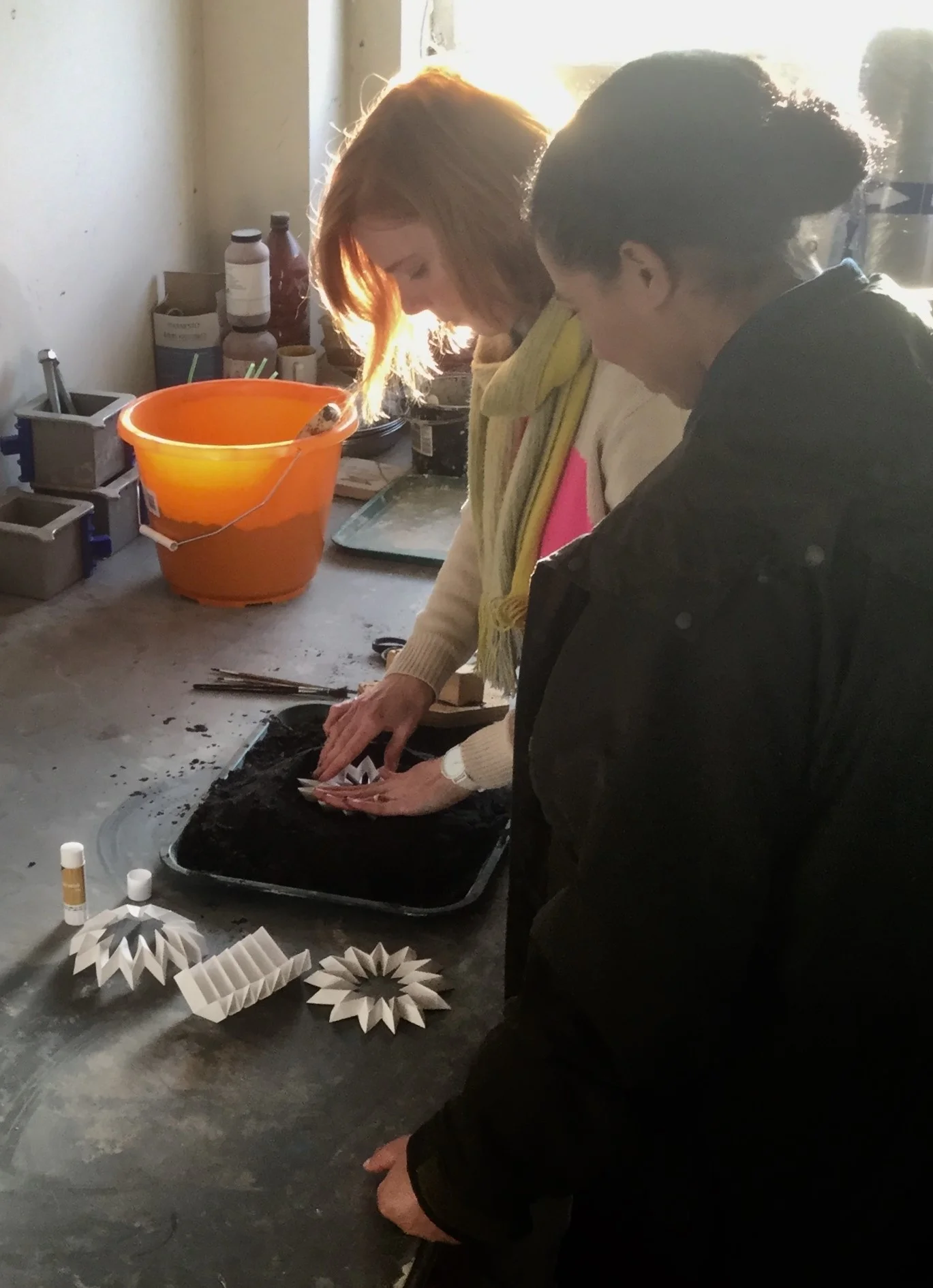Hannah George shows presenter Margherita Taylor how sand casting paper art can make space for nature in built environment.