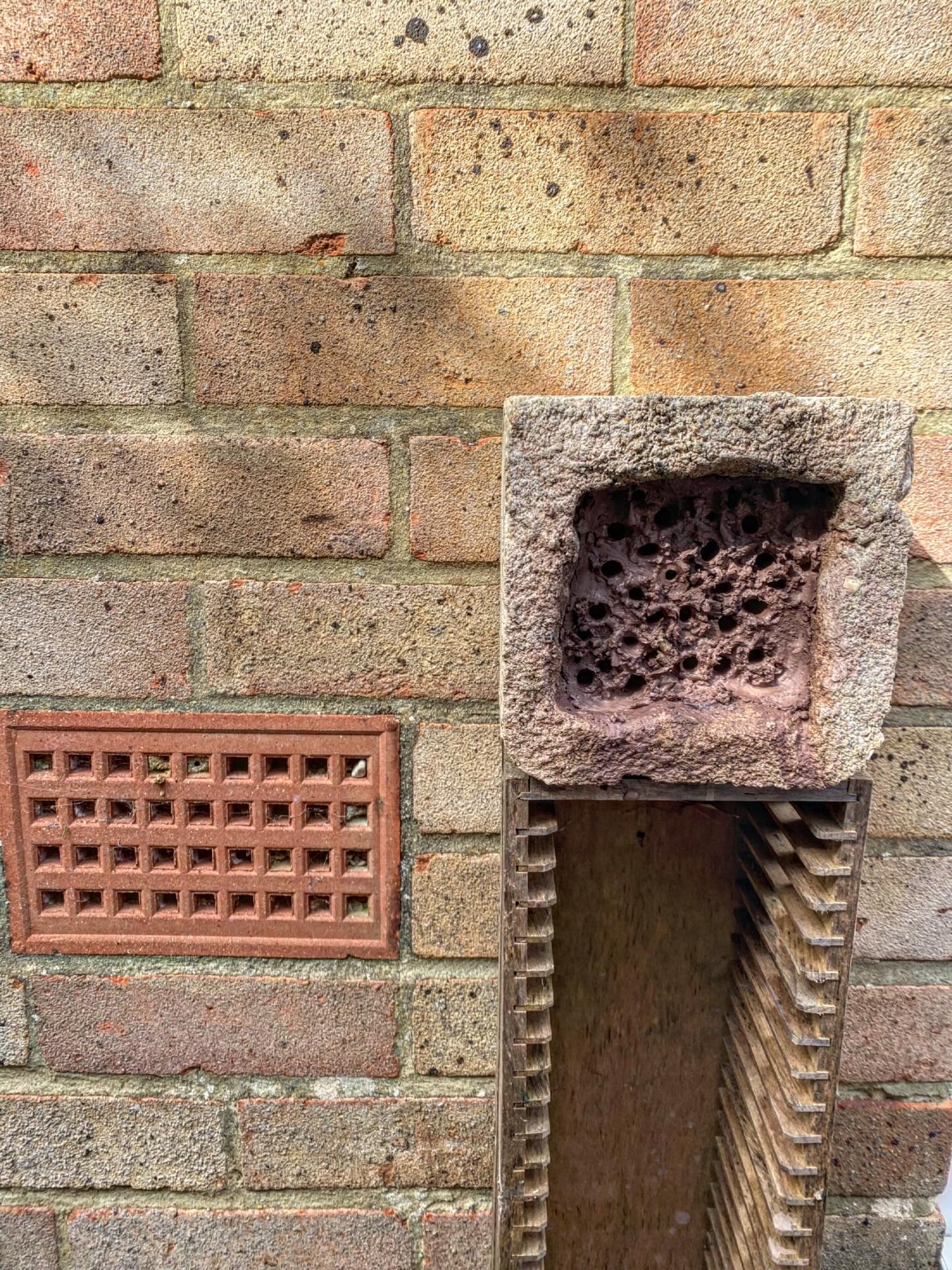 A substrate filled block and a standard ventilation brick, soon to be joined by a converted CD rack. 
Who lives in homes like these?