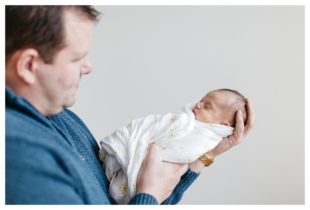 Look at how tiny Cecilia is in dad's hands!