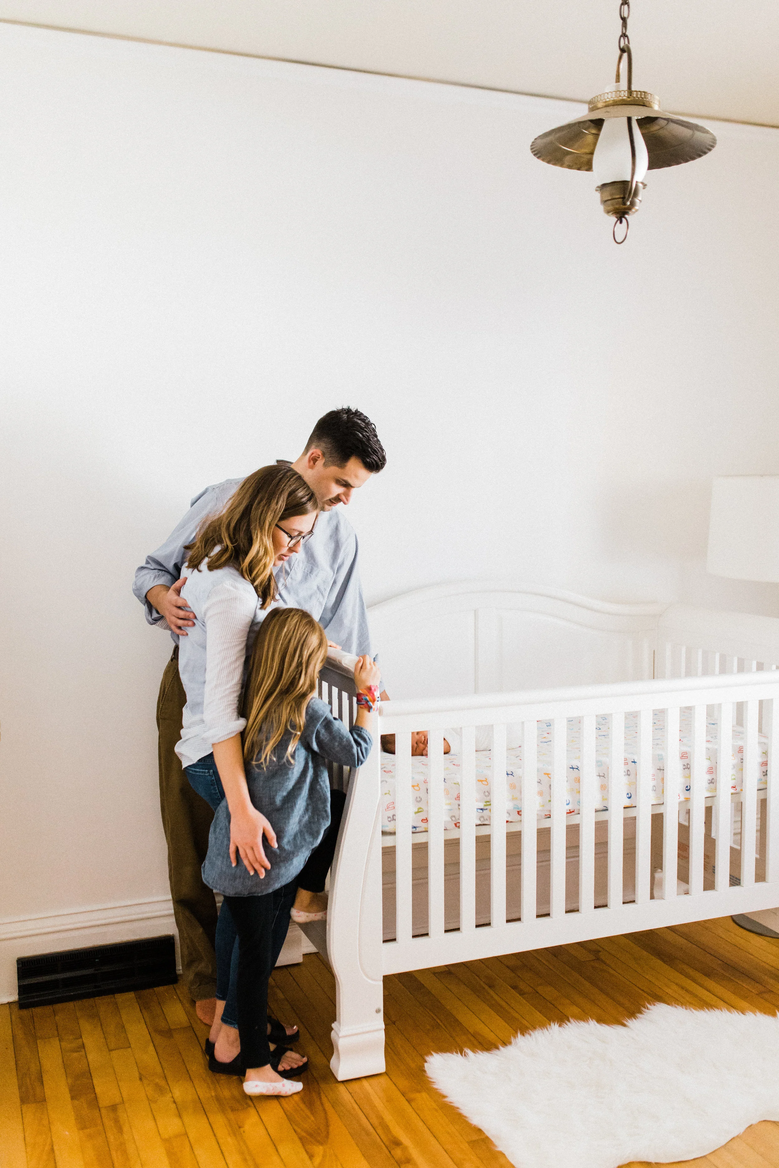 Lifestyle Newborn Photography in baby's nursery