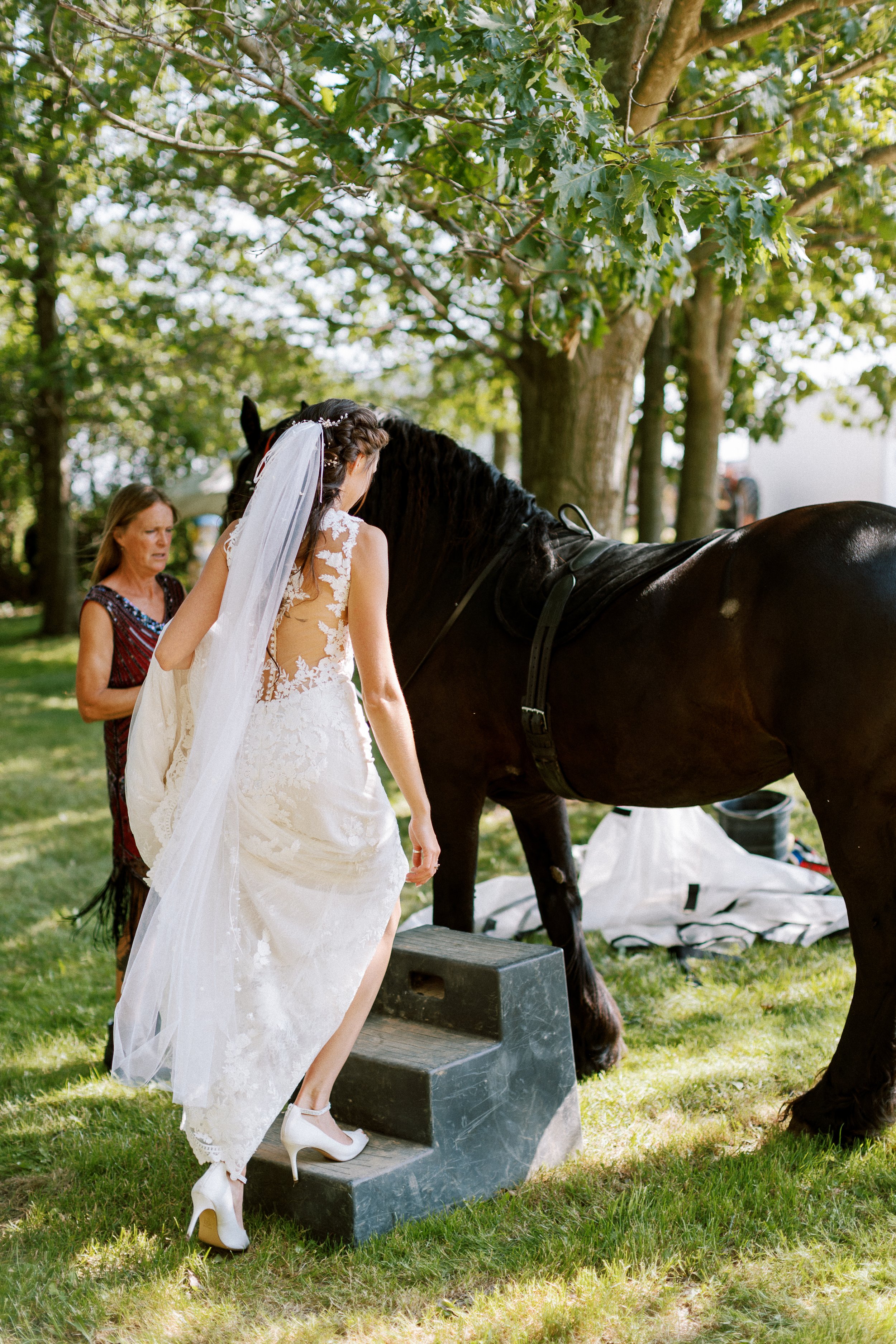 bride getting on horse
