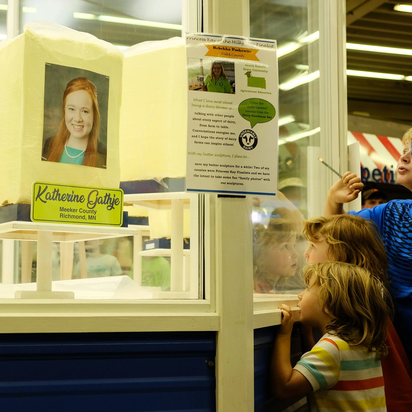 Every year at the Minnesota State Fair, county dairy princesses have their likenesses sculpted into butter. Here, kids check out the blocks of butter waiting to be carved — August 2018