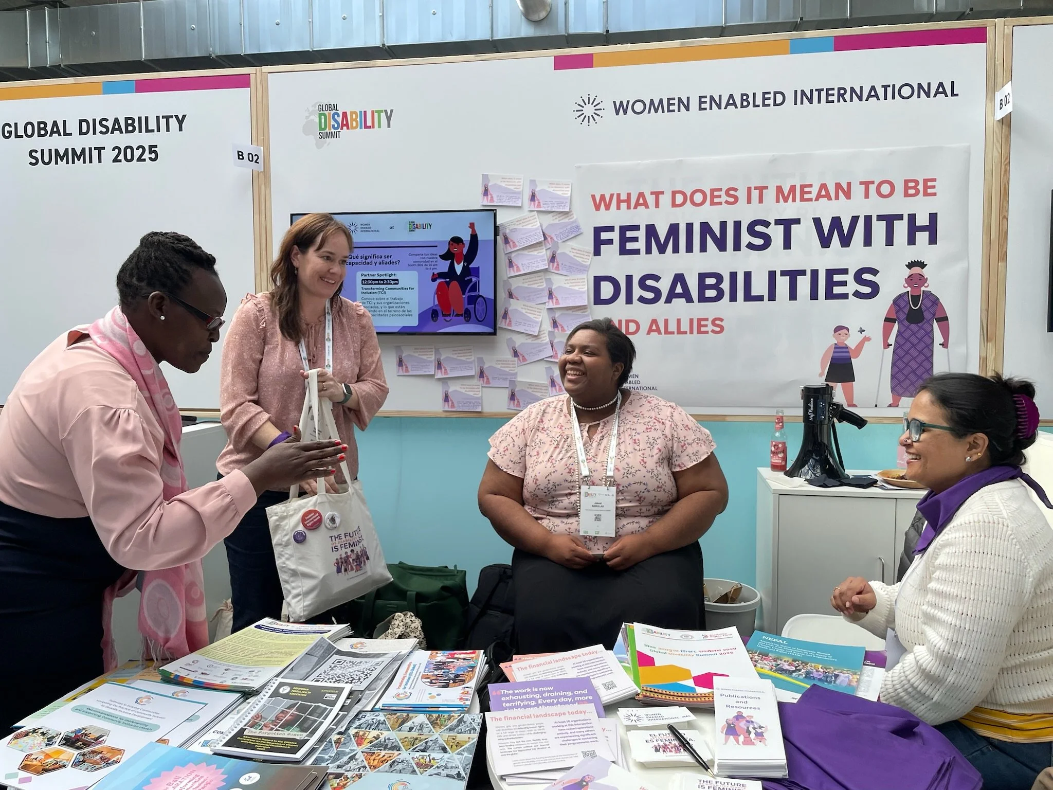 Women at the WEI booth at GDS