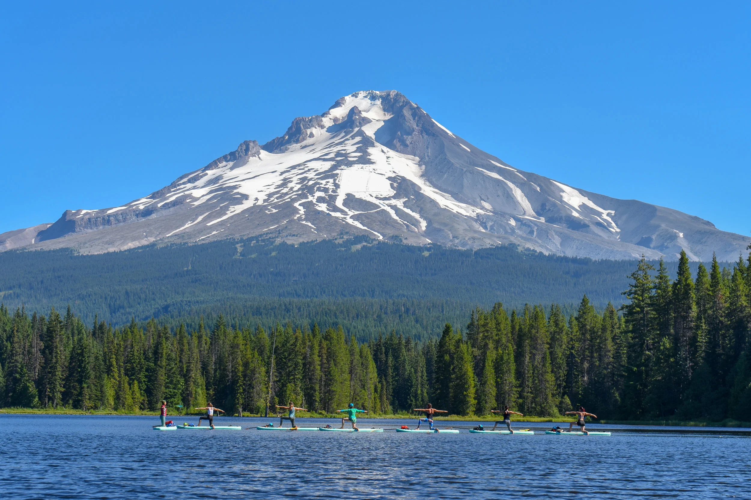 Yoga teachers Warrior 2 with Mount Hood.jpg