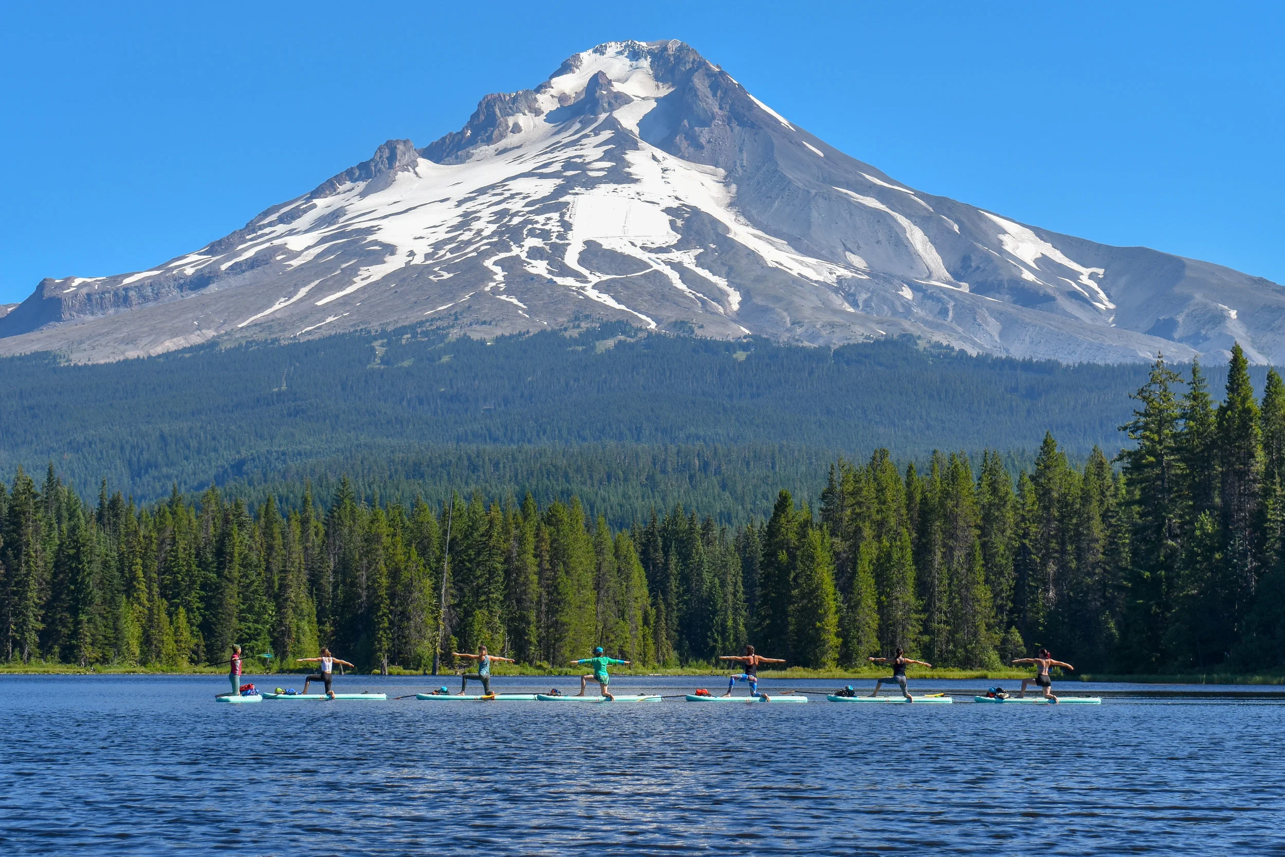 Yoga teachers Warrior 2 with Mount Hood.jpg