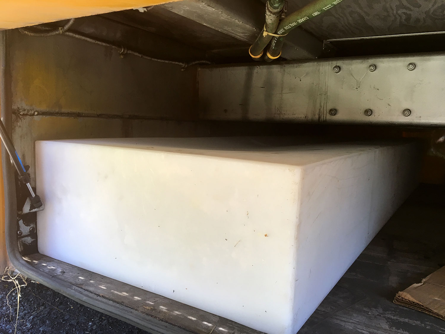 The pass-through bays were just tall enough to fit our 100 gallon gray water tank.