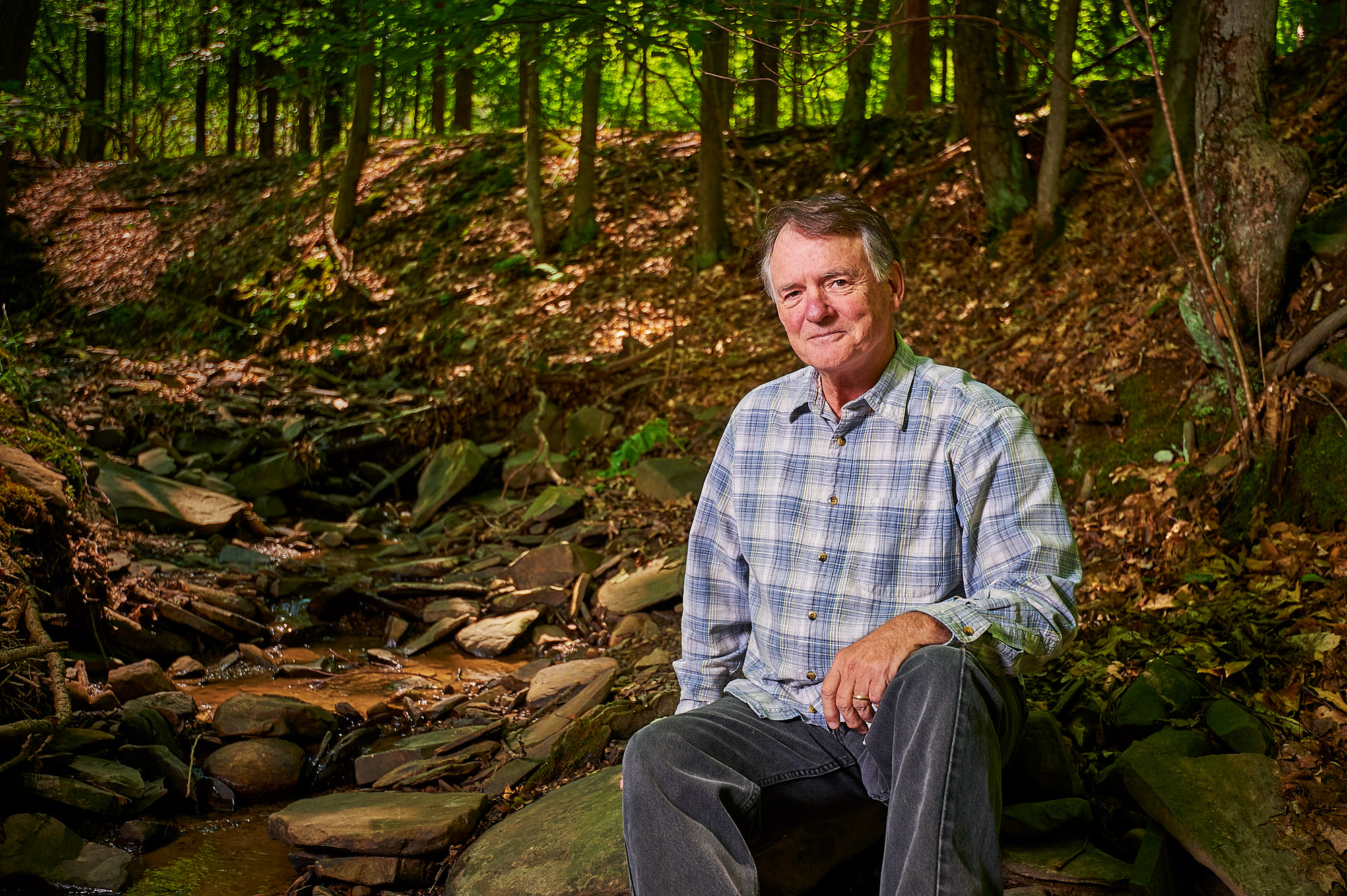 Rick Marsi, Naturalist, Photographer and Author, photographed beside a stream on his property in Vestal, NY