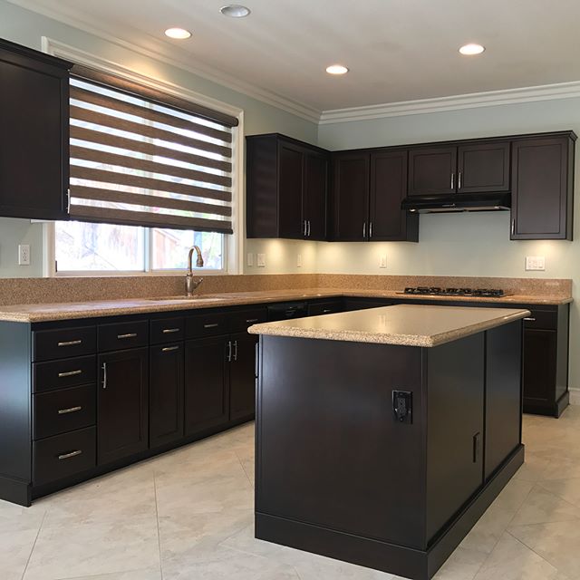 Recently finished, full Kitchen remodel in Anaheim, CA. Tap photo for multiple perspective. Kitchen cabinets and TV console where refinished from a Natural Maple to a Kona color, which was refreshing for us since we seem to do mostly gray and white k