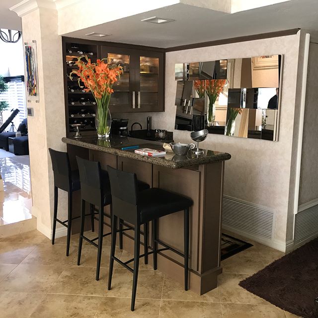 Bar &amp; guest bathroom re faced and re finished in Anaheim, CA. All doors where replaced with solid maple 3&rdquo; shaker style doors and finished in a beautiful driftwood stain. A 6&rdquo; baseboard and decor panels were also added to bar to give 