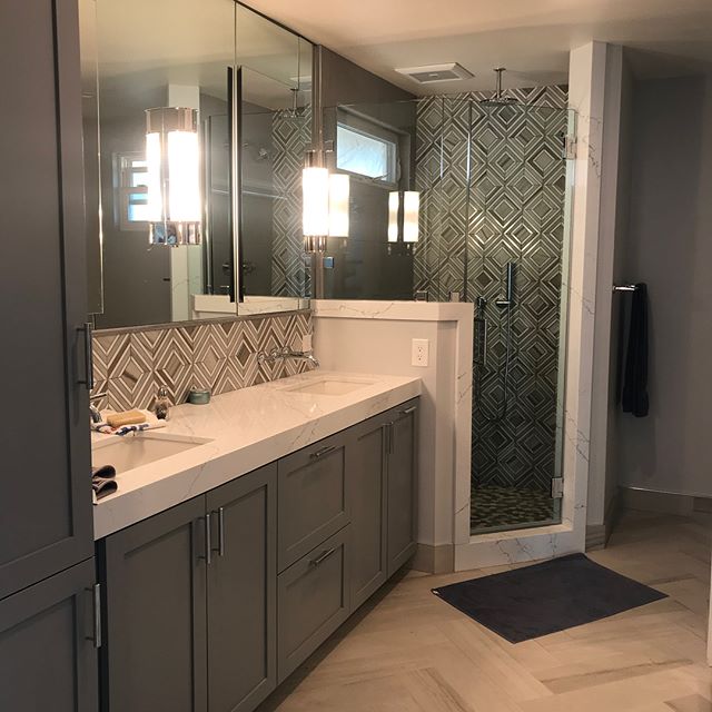 Remodeled  Master bathroom and bedroom. Costa Mesa, CA. Bathroom was fully remodeled with new 2&rdquo; frameless shaker style cabinets in a harbor mist lacquer painted gray color. All doors have soft closing Blum hinges along with Satin Nickel handle