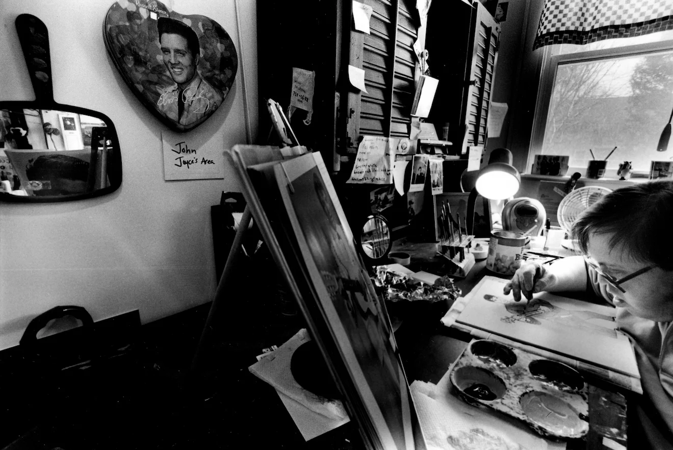 John Joyce paints pictures of Elvis Presley at Spindleworks, a non-profit arts center for adults with disabilities located in Brunswick, Maine.
