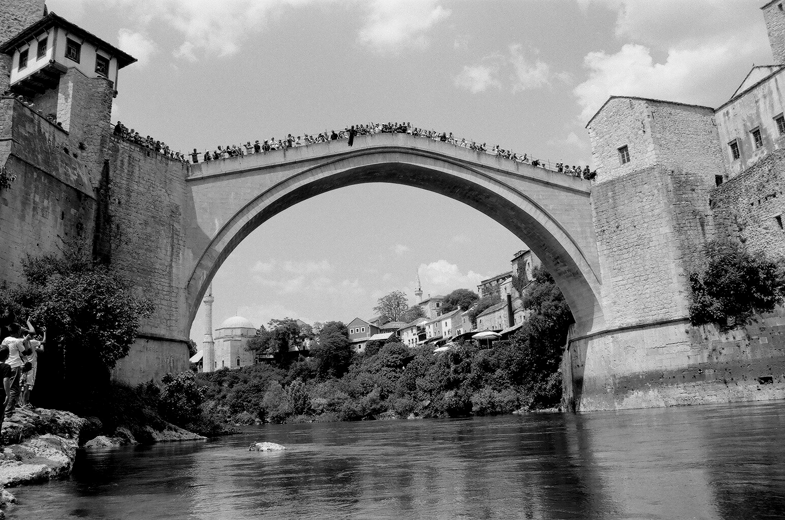  Minimally edited film photos show young Bosnians gathering courage and raising money to jump off the Stari Most bridge in Mostar, rural landscapes, and bullet holes left during the Bosnian War for Independence in Bihac.&nbsp; 