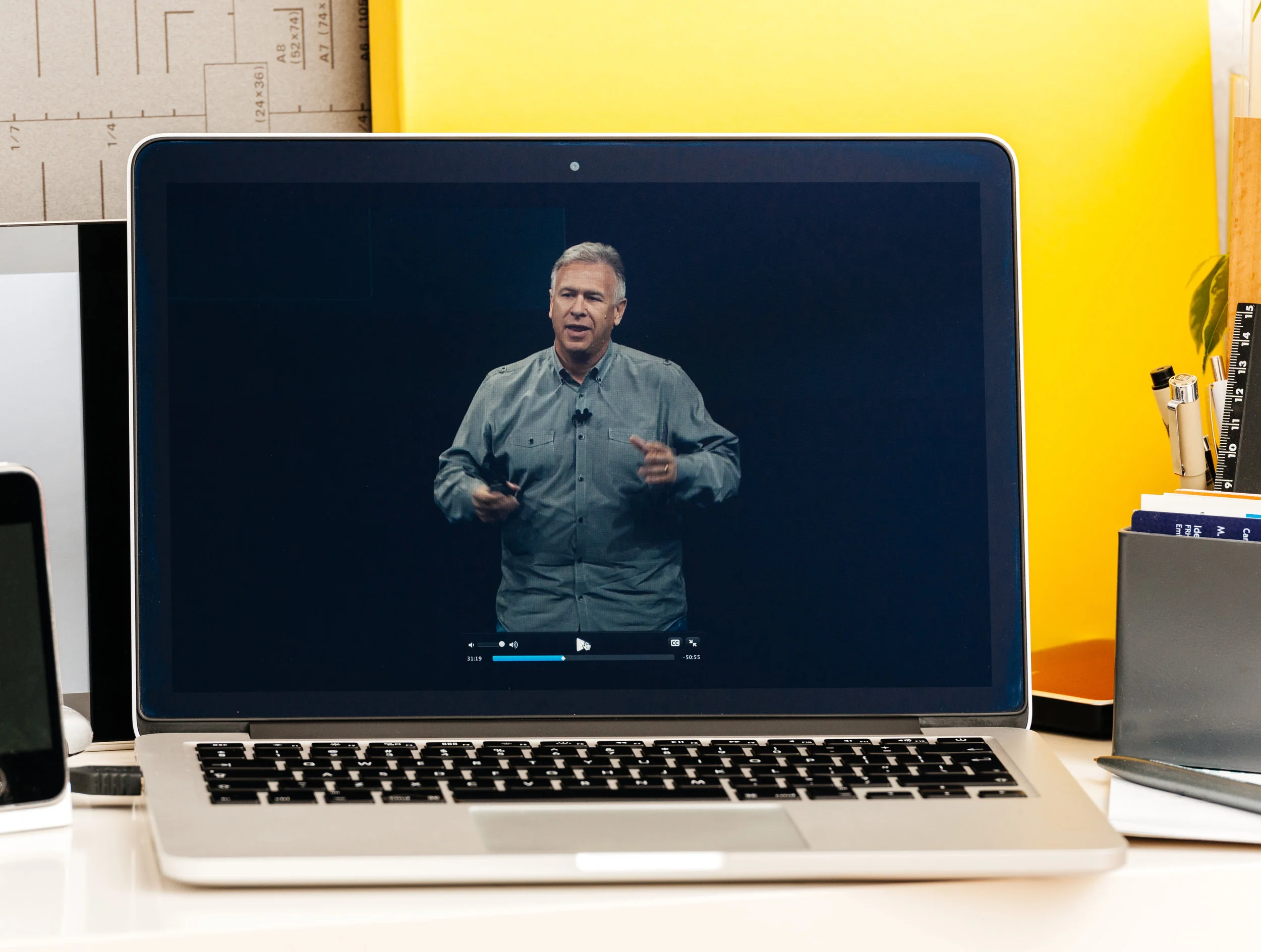 Philip schiller talks about changes to Apple's Macbook Pro. photo: Hadrian/shutterstock