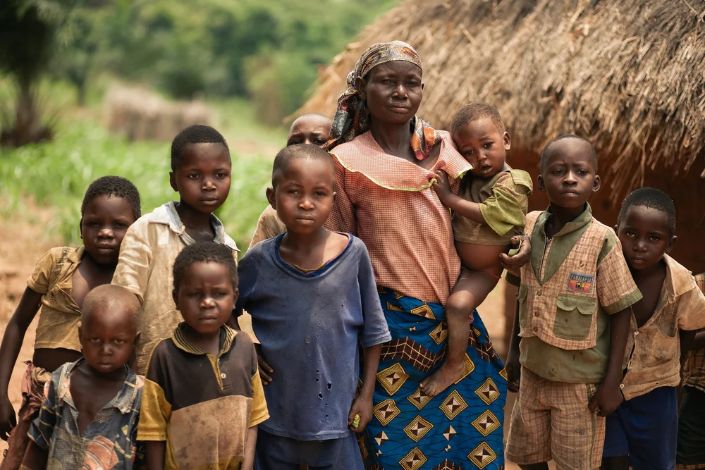 a mother with her children in congo. photo: Valeriya Anufriyeva/shutterstock
