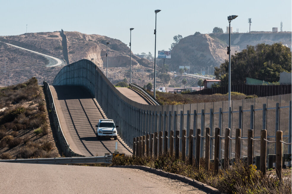 Border patrol drives along the U.S. Mexico Border in California. Sherry V Smith/shutterstock