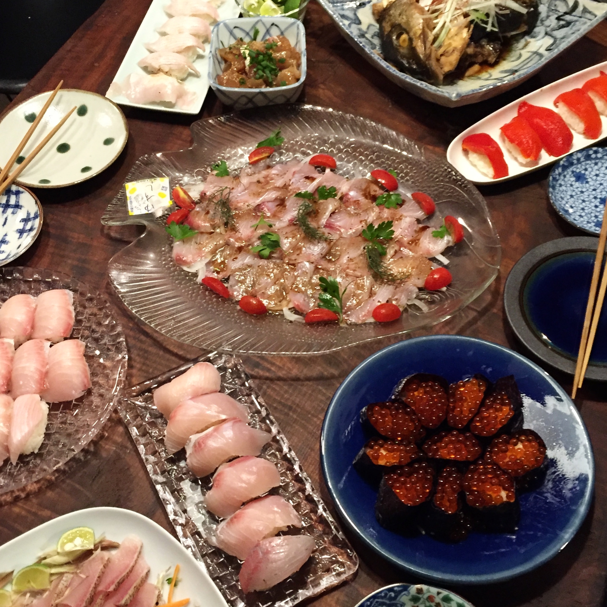 The center dish was fresh-caught yellowtail, carpaccio style, they called it, with a mouth-watering vinaigrette on top. 