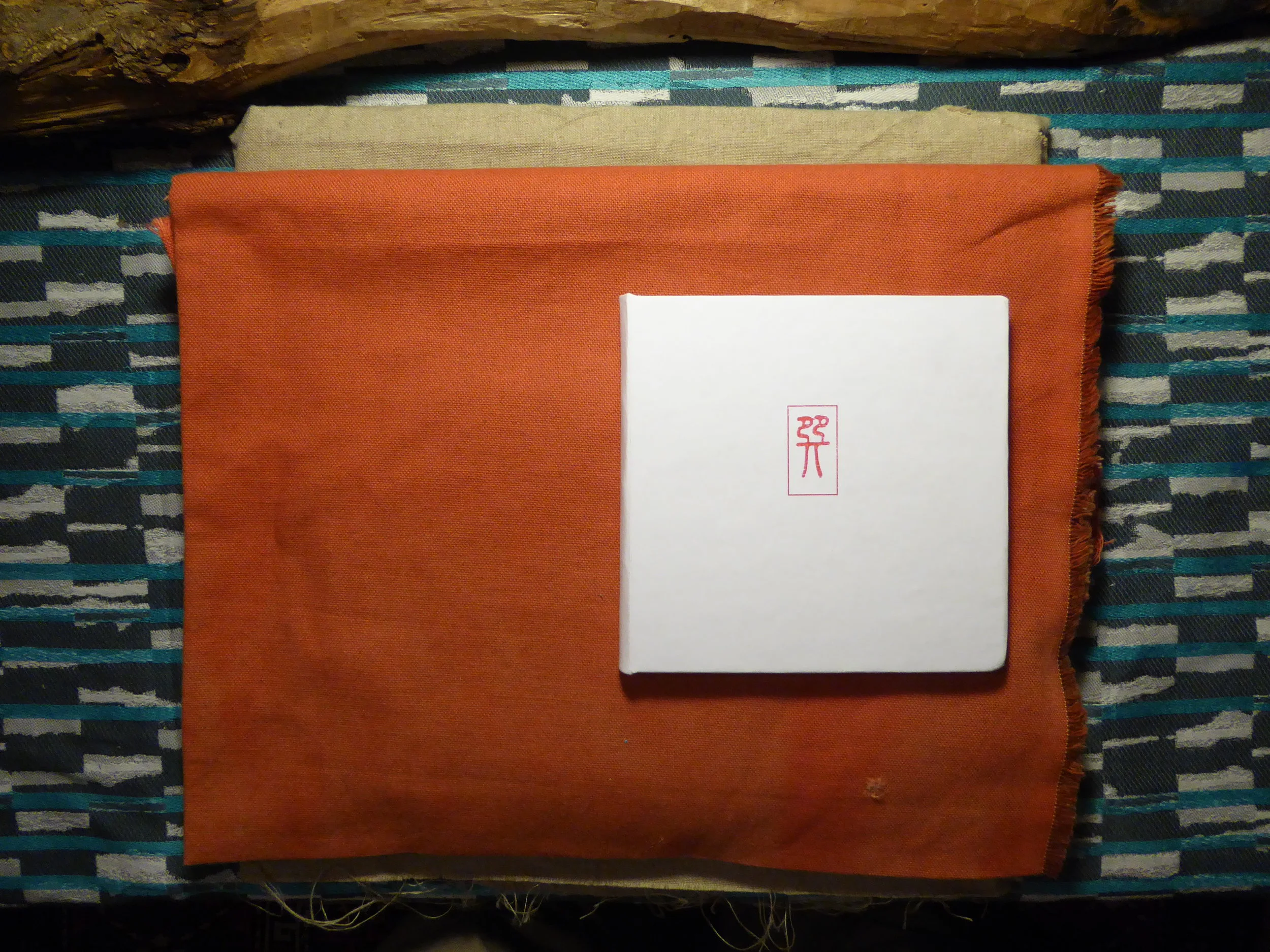  Xun, an I Ching (2017). This book presents the 64 hexagrams of the  I Ching , a book of wisdom, also considered a divinatory tool, from ancient China. The text snaking along the bottom of each page and culminating in the concrete typography at the e