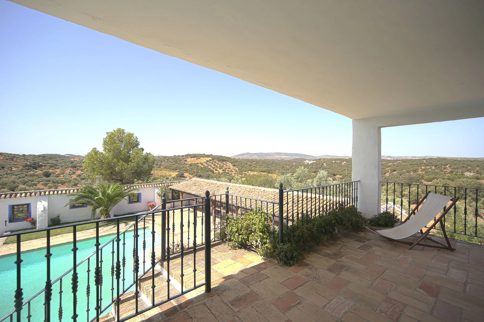 Terrace off master bedroom, steps leading to pool