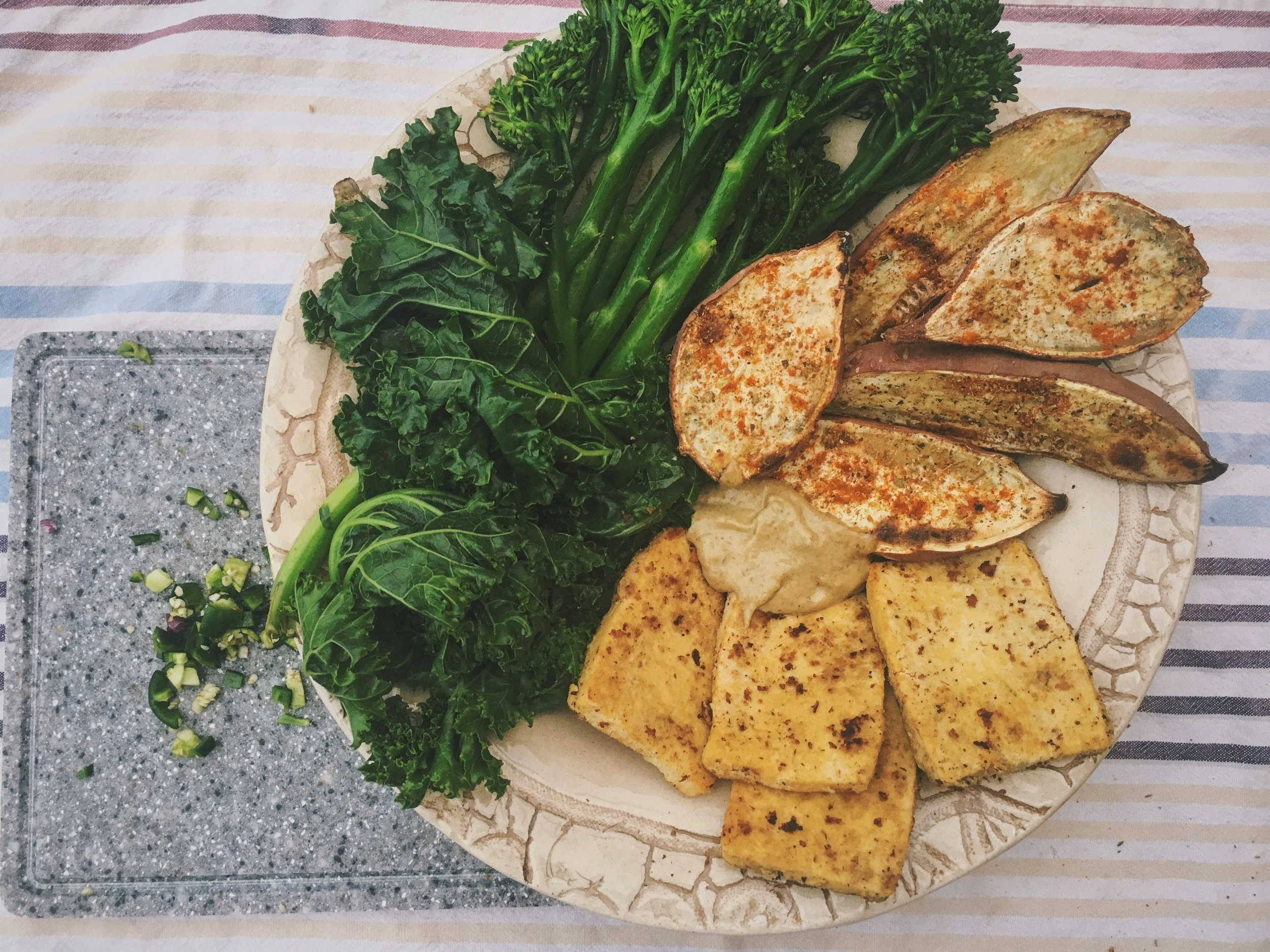 sweet potatoes, kale, broccoli, tofu Buddah bowl with pumpkin seed butter 