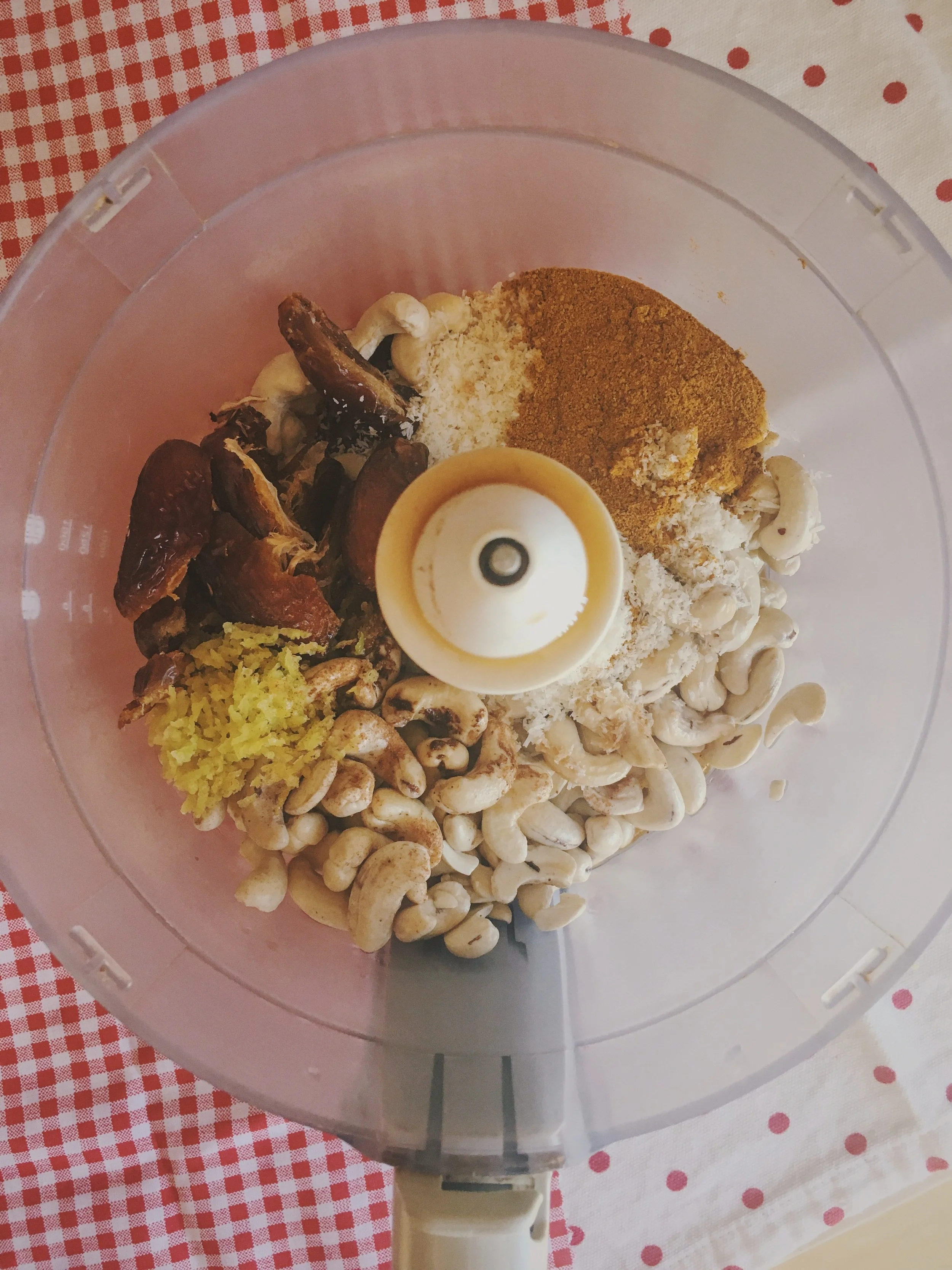 cashews, dates, lemon zest, cinnamon, coconut, turmeric in the food processor 