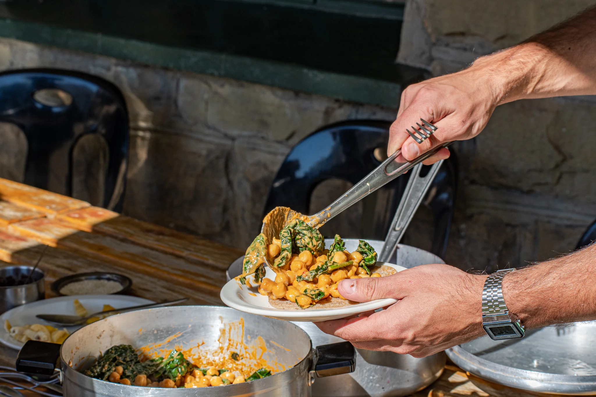 Buckwheat pancakes served with chickpea and spinach peanut butter curry