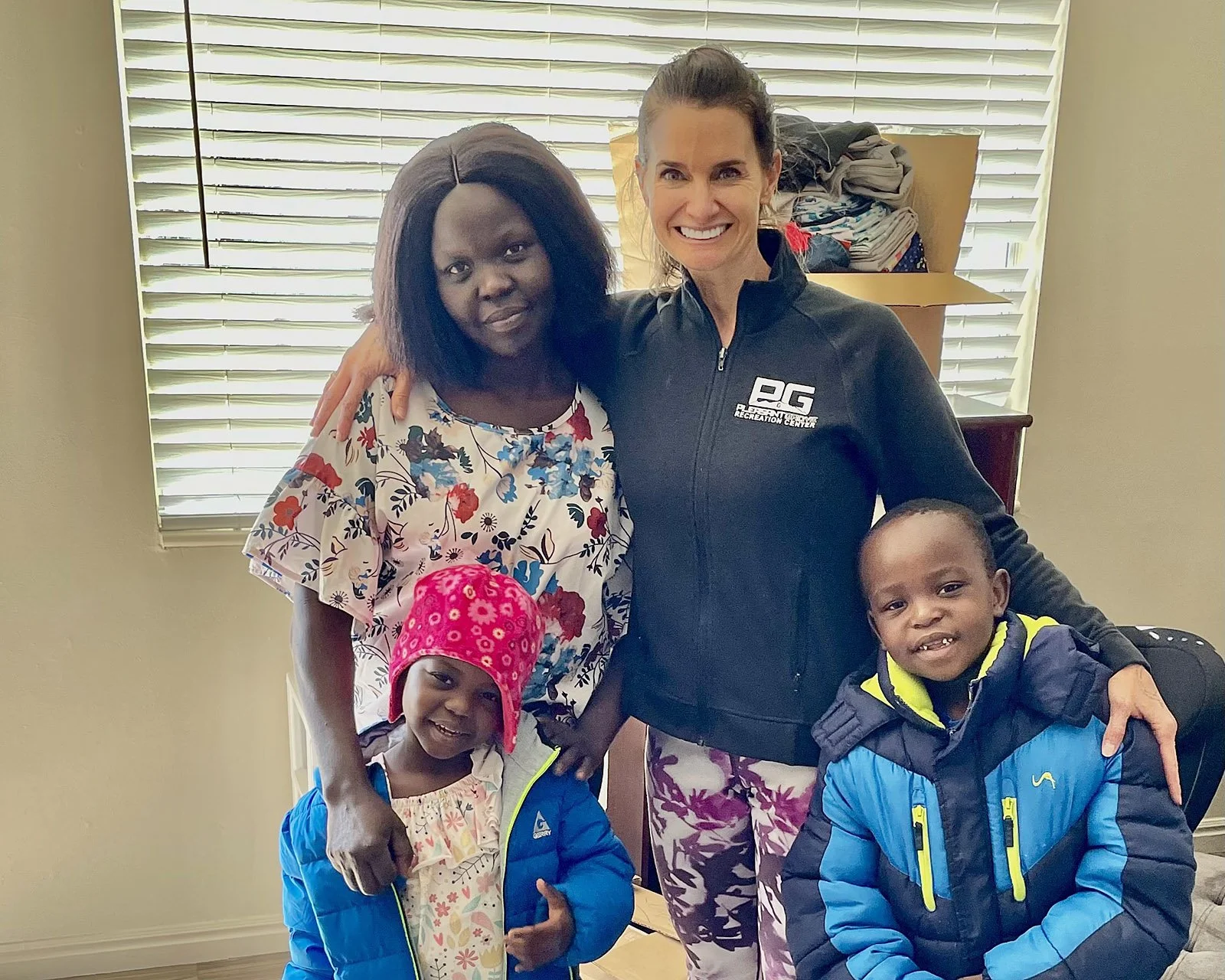  Anne, LHI Refugee Resettlement Manager, with Joyce and two of her children. 