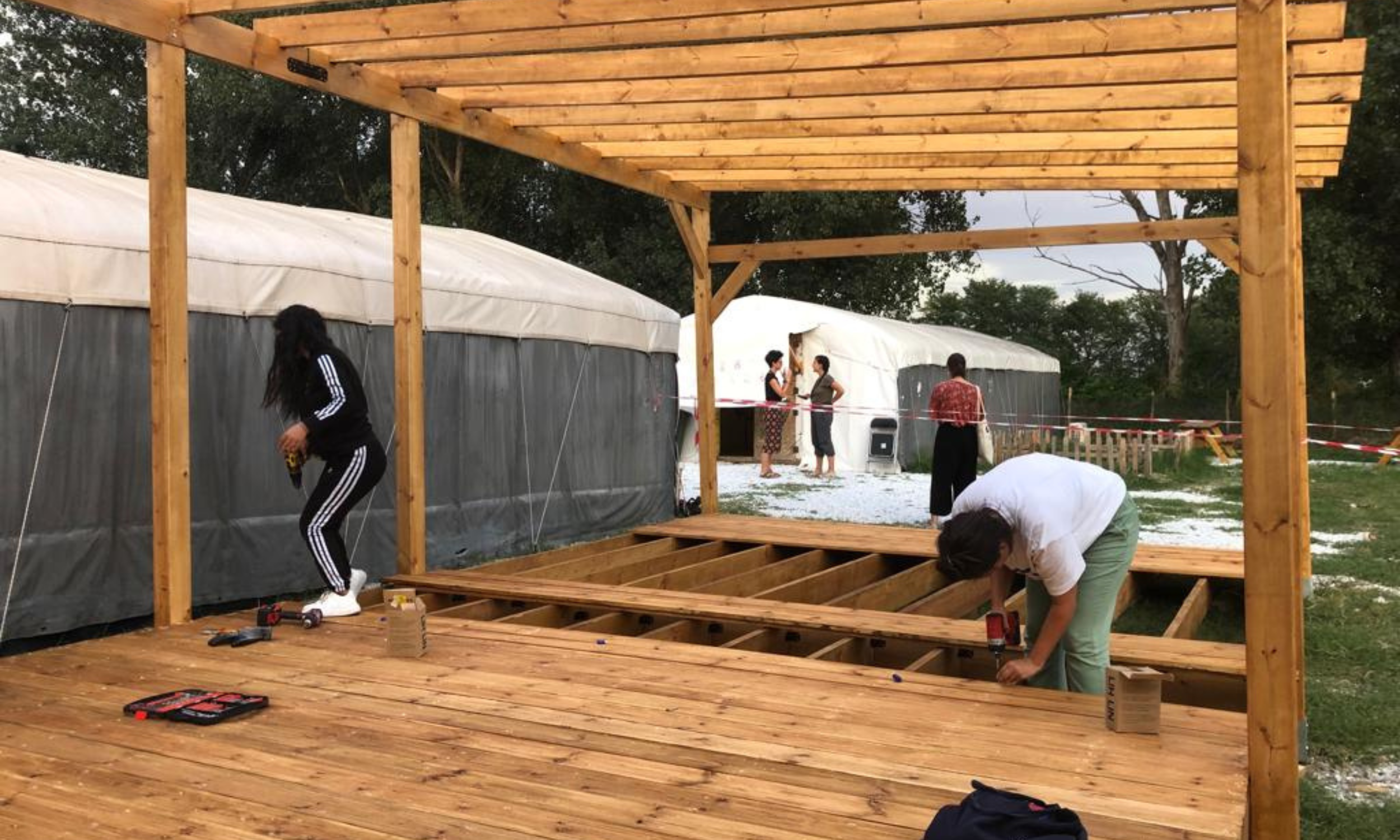   Volunteers build a pergola at the LHI Community Center. The pergola now houses the Community Center’s Arts and Recreation programs.  