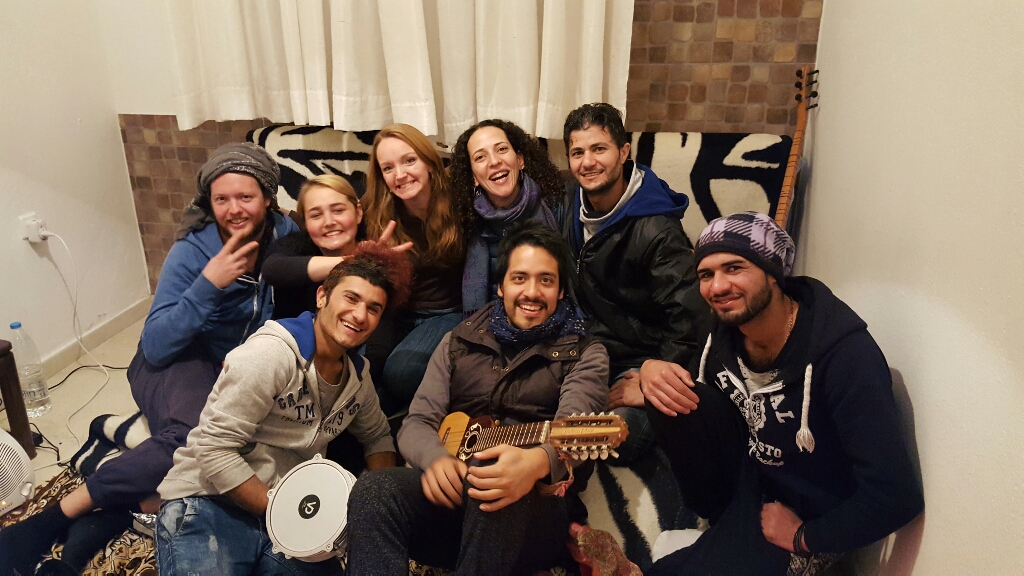 "One thing I love about this work is the people it brings together from all over the world. In this photo we had 3 Iraqis, an American, Mexican, Frenchman, Egyptian, and an Irish lass, jamming out to an Iraqi Saz and a Bolivian guitar. All in one small room in Greece. :)"