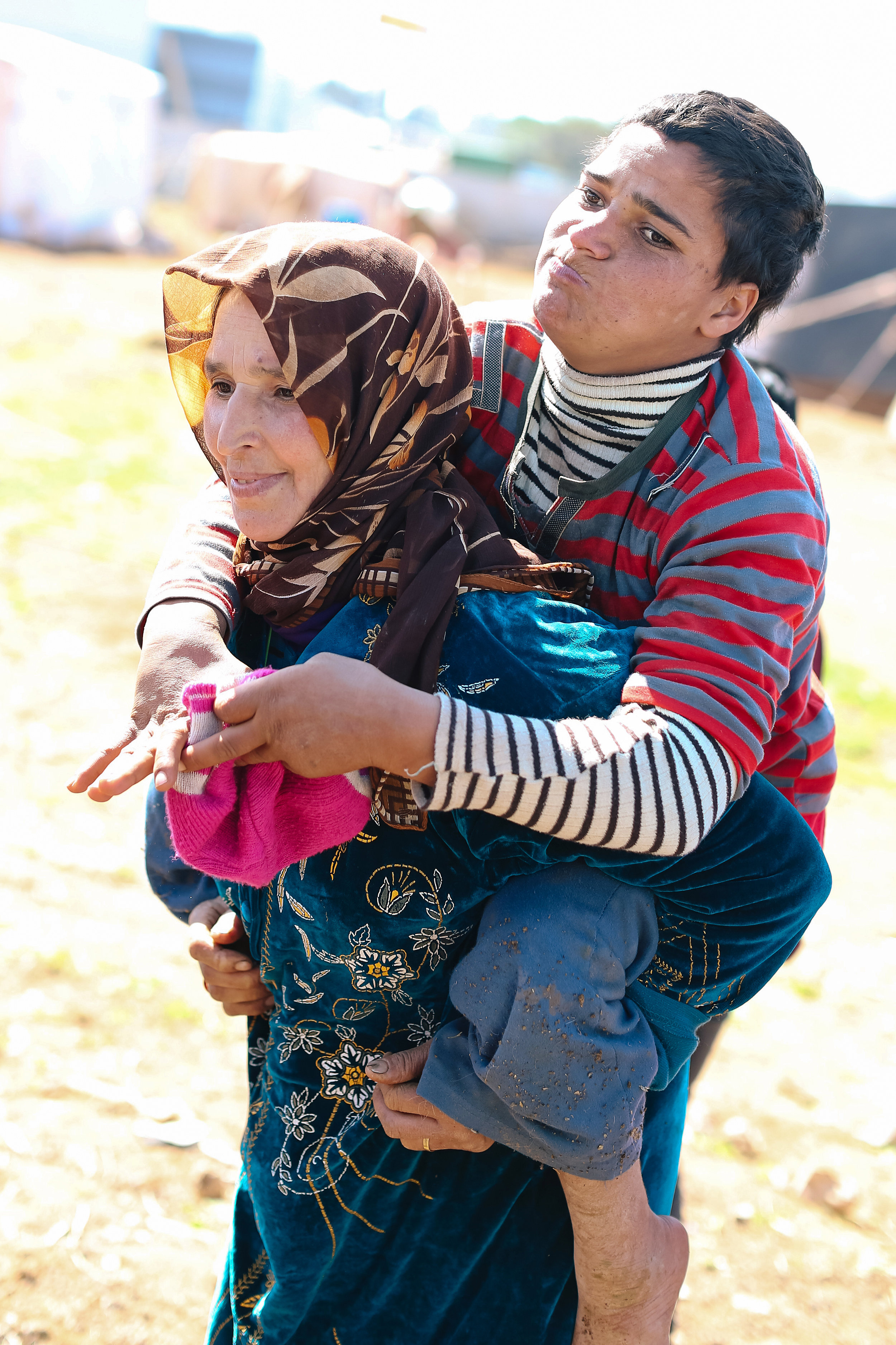 Fatima, 16 years old, is severely disabled, both physically and mentally. She prefers to crawl over sitting in a wheelchair. A few days before our visit, she had injured her foot by crawling over a broken bottle. Her mother carried her to us asking for some medicine. 