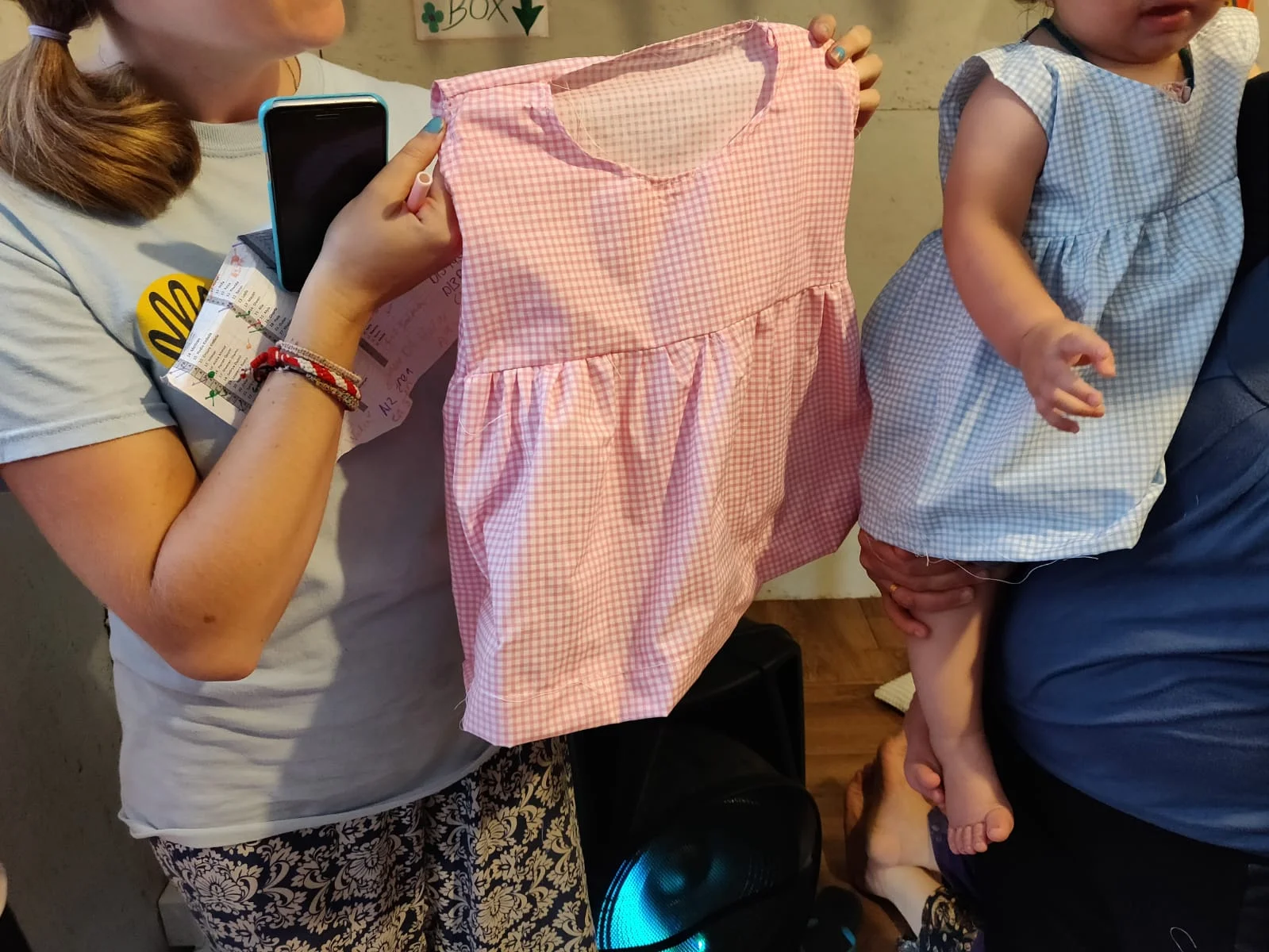  One of the Yazidi women sewed these two dresses for her baby in one sitting. 
