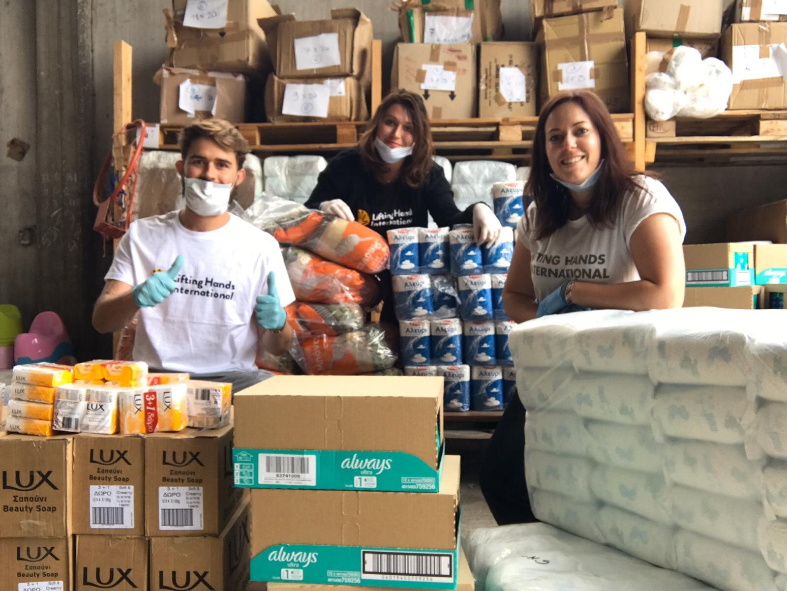   Nick, Margaux, and Millie in LHI’s aid distribution warehouse. Serres, Greece.  