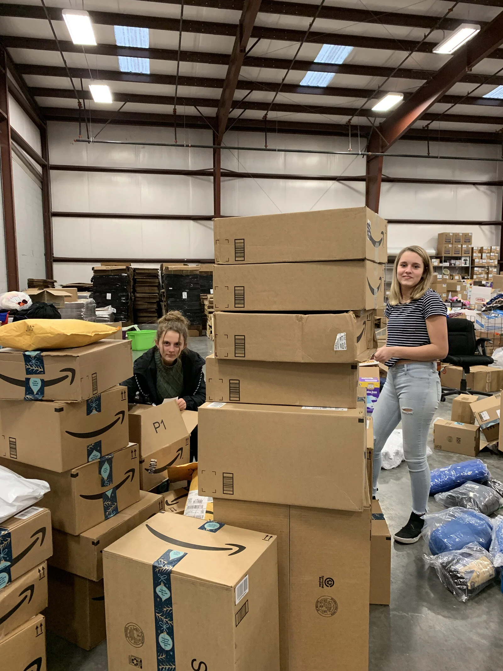   Volunteers help sort through items donated through our Amazon Wishlist.  